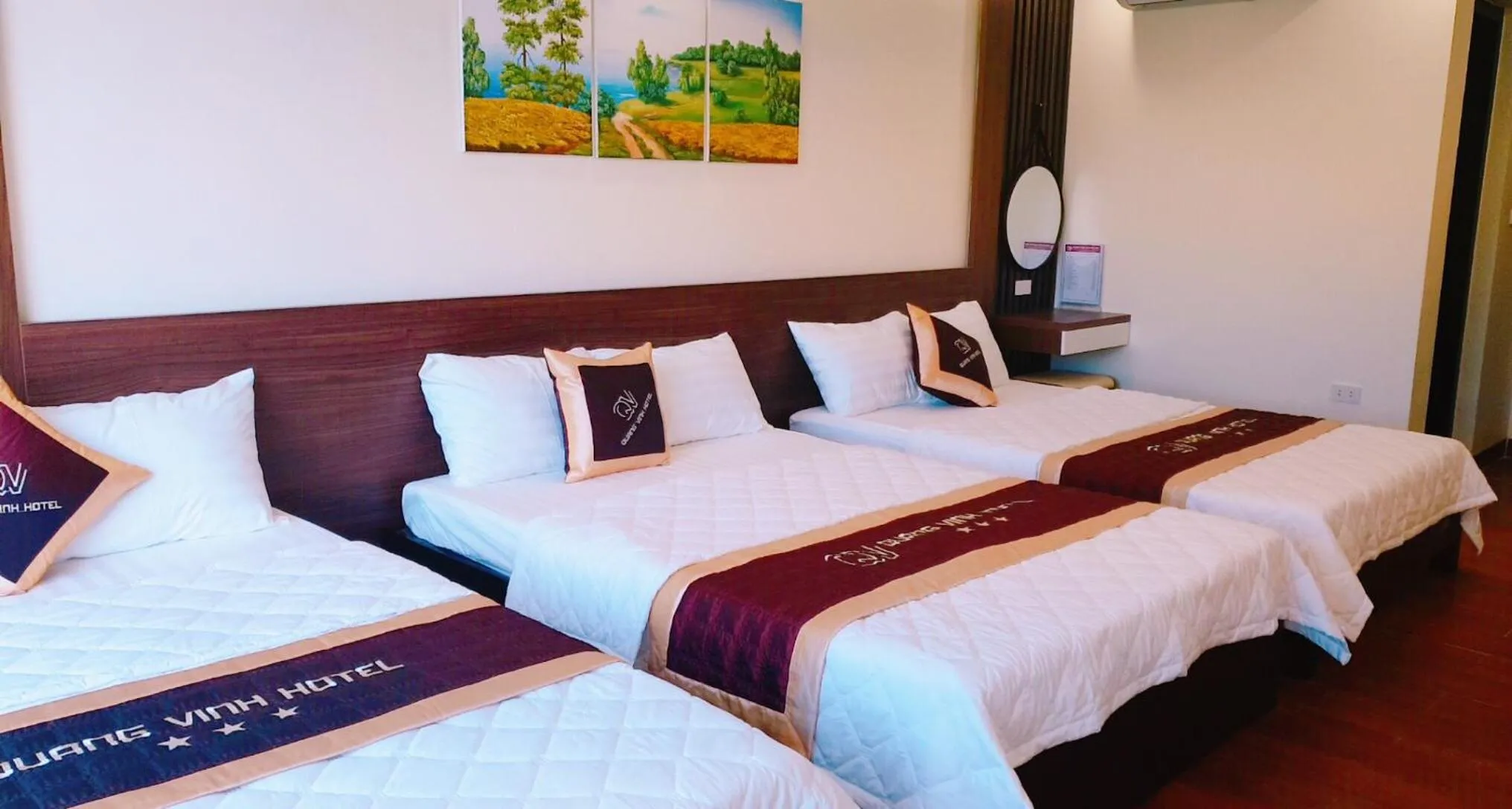 Bed in QUANG VINH HOTEL
