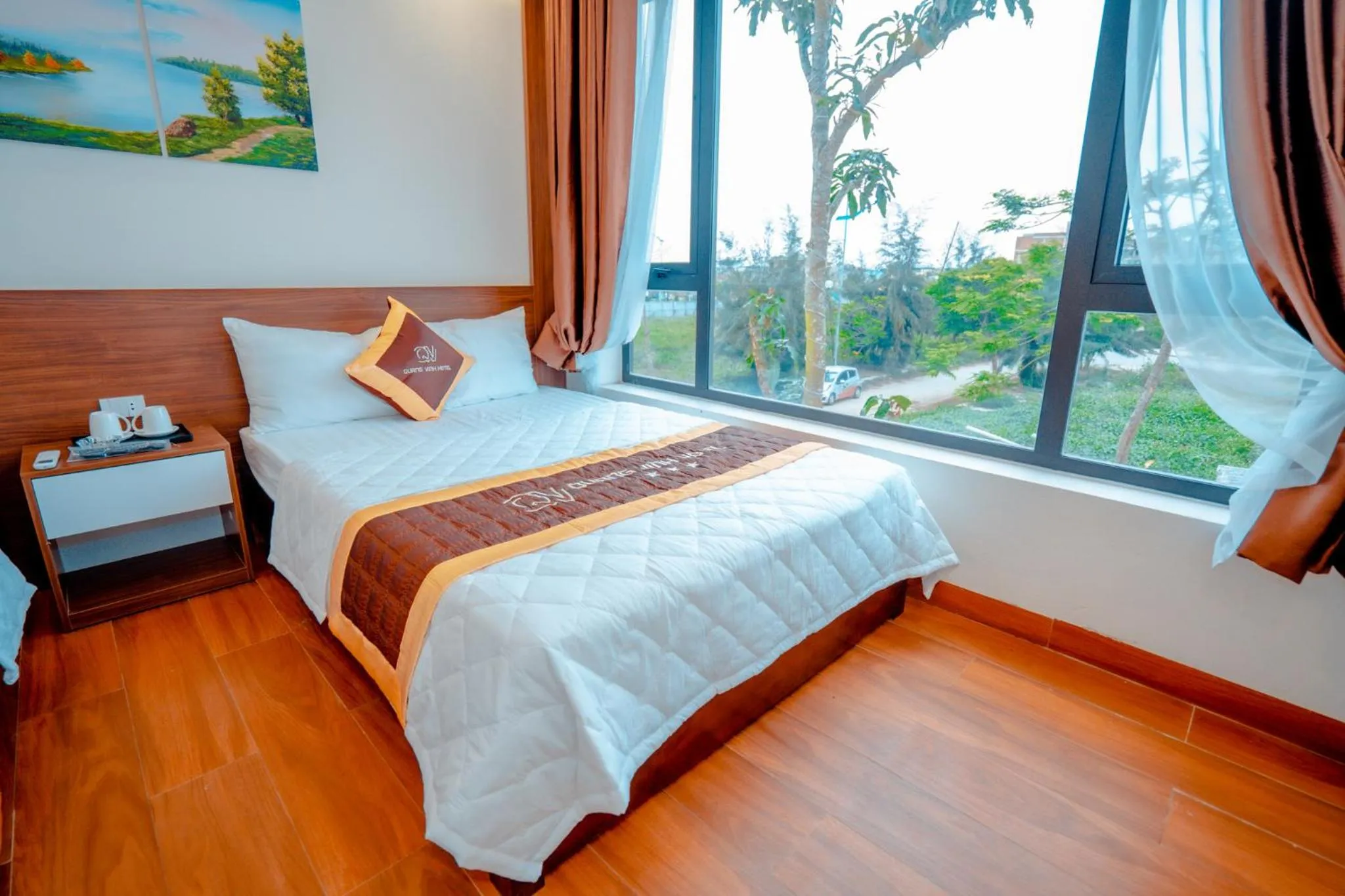 Bed in QUANG VINH HOTEL