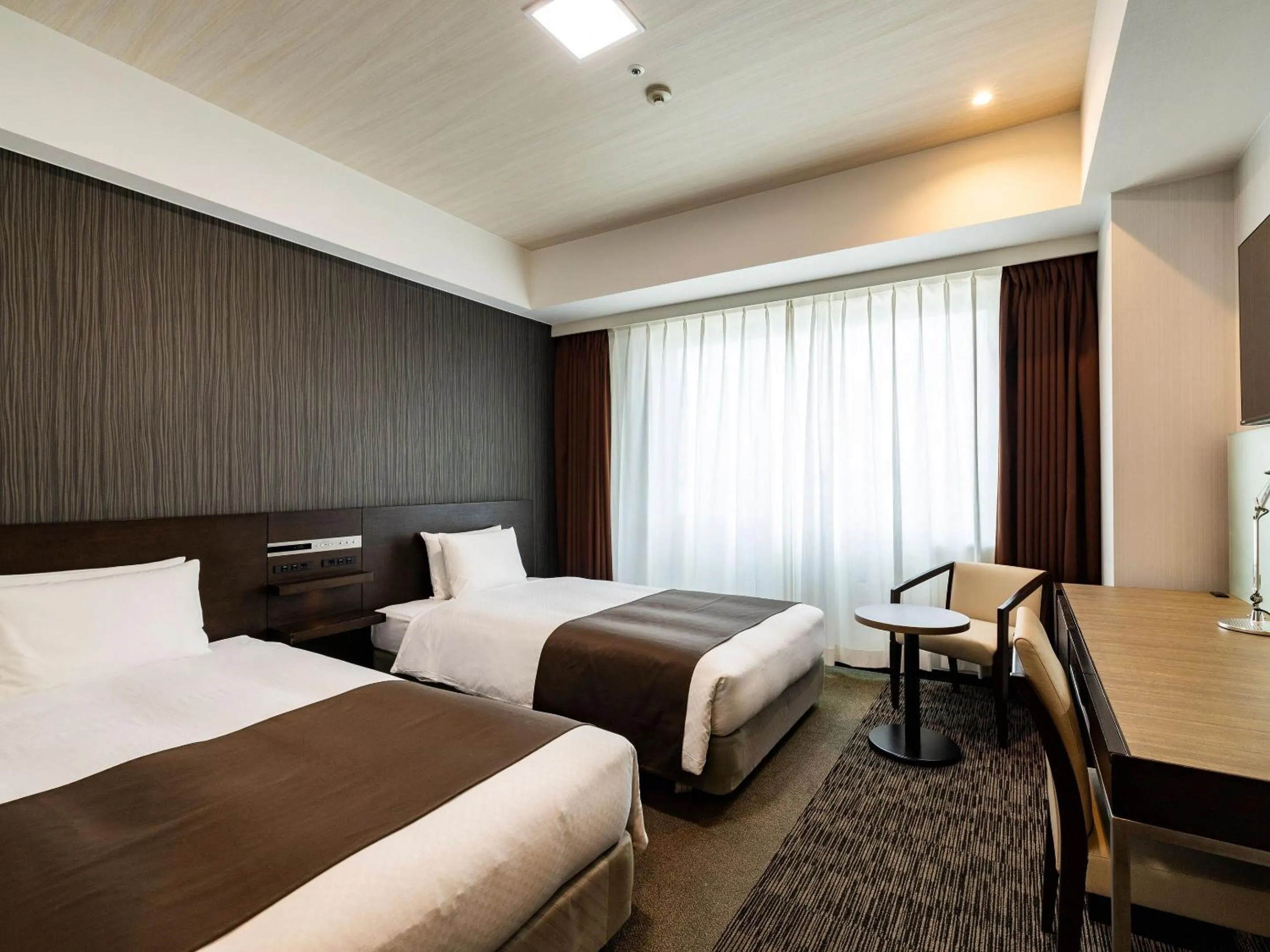 Photo of the whole room, Bed in KOKO HOTEL Premier Hakata - formerly Tenza Hotel at Hakata Station