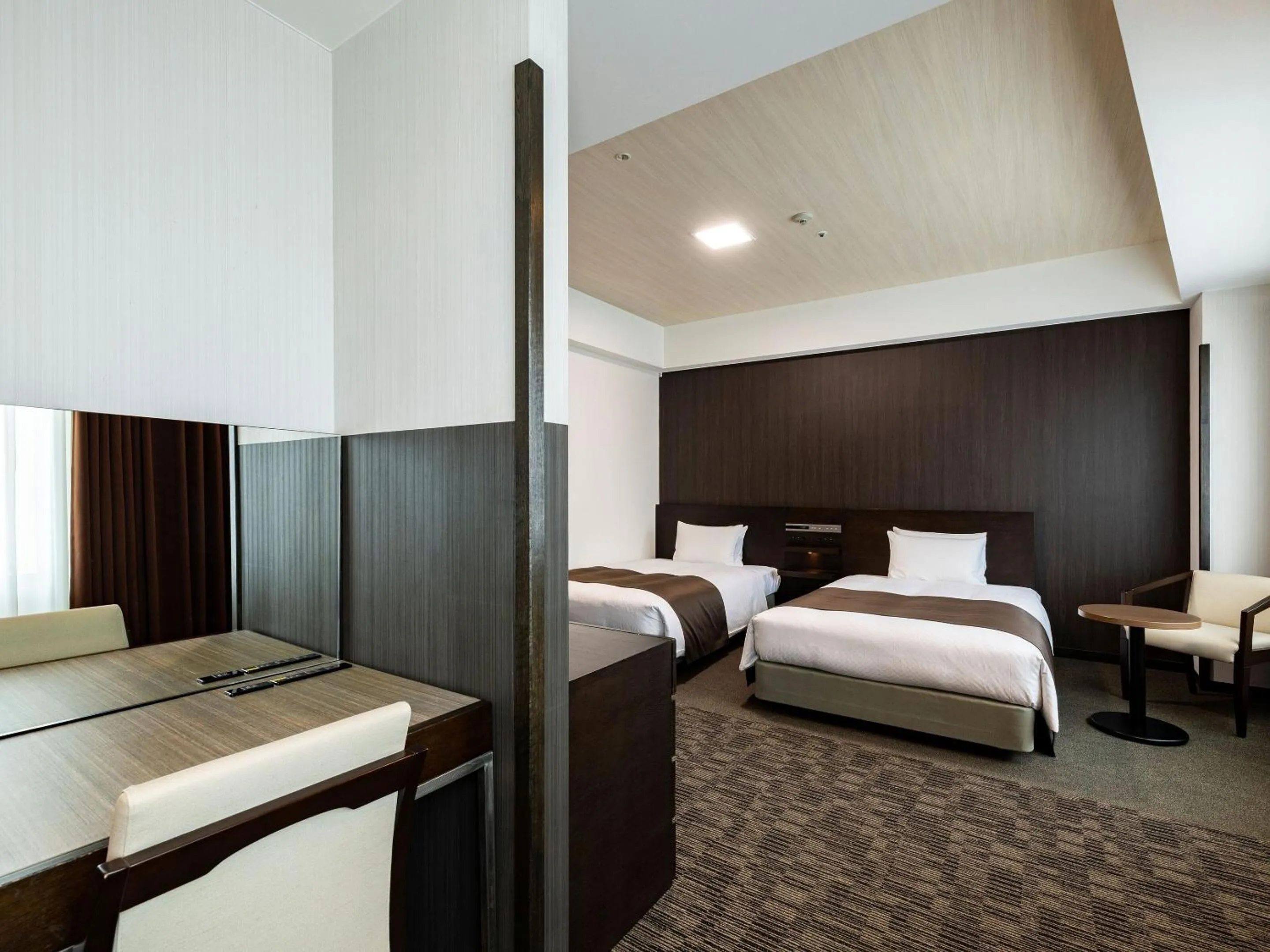 Photo of the whole room, Bed in KOKO HOTEL Premier Hakata - formerly Tenza Hotel at Hakata Station