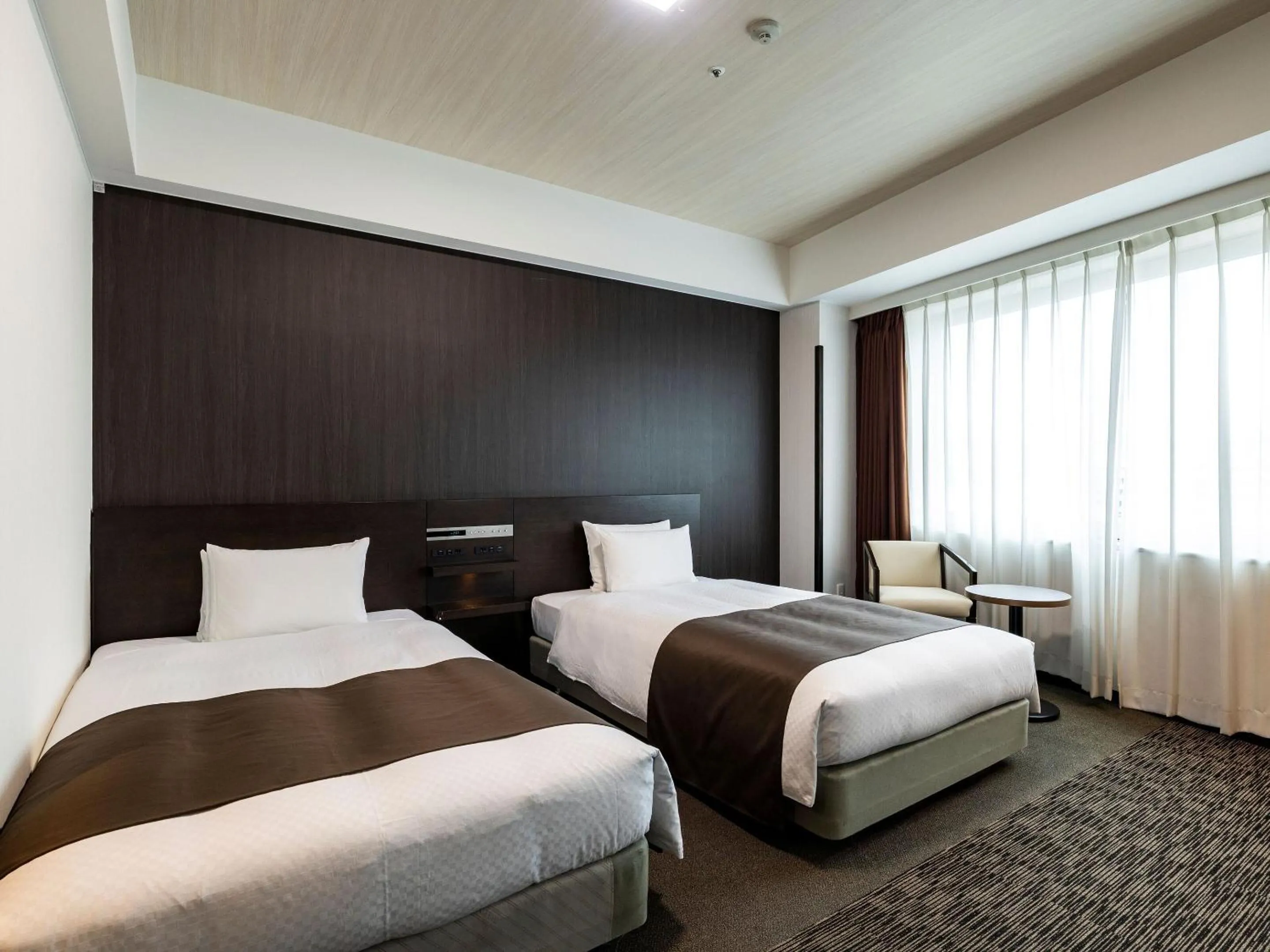 Photo of the whole room, Bed in KOKO HOTEL Premier Hakata - formerly Tenza Hotel at Hakata Station