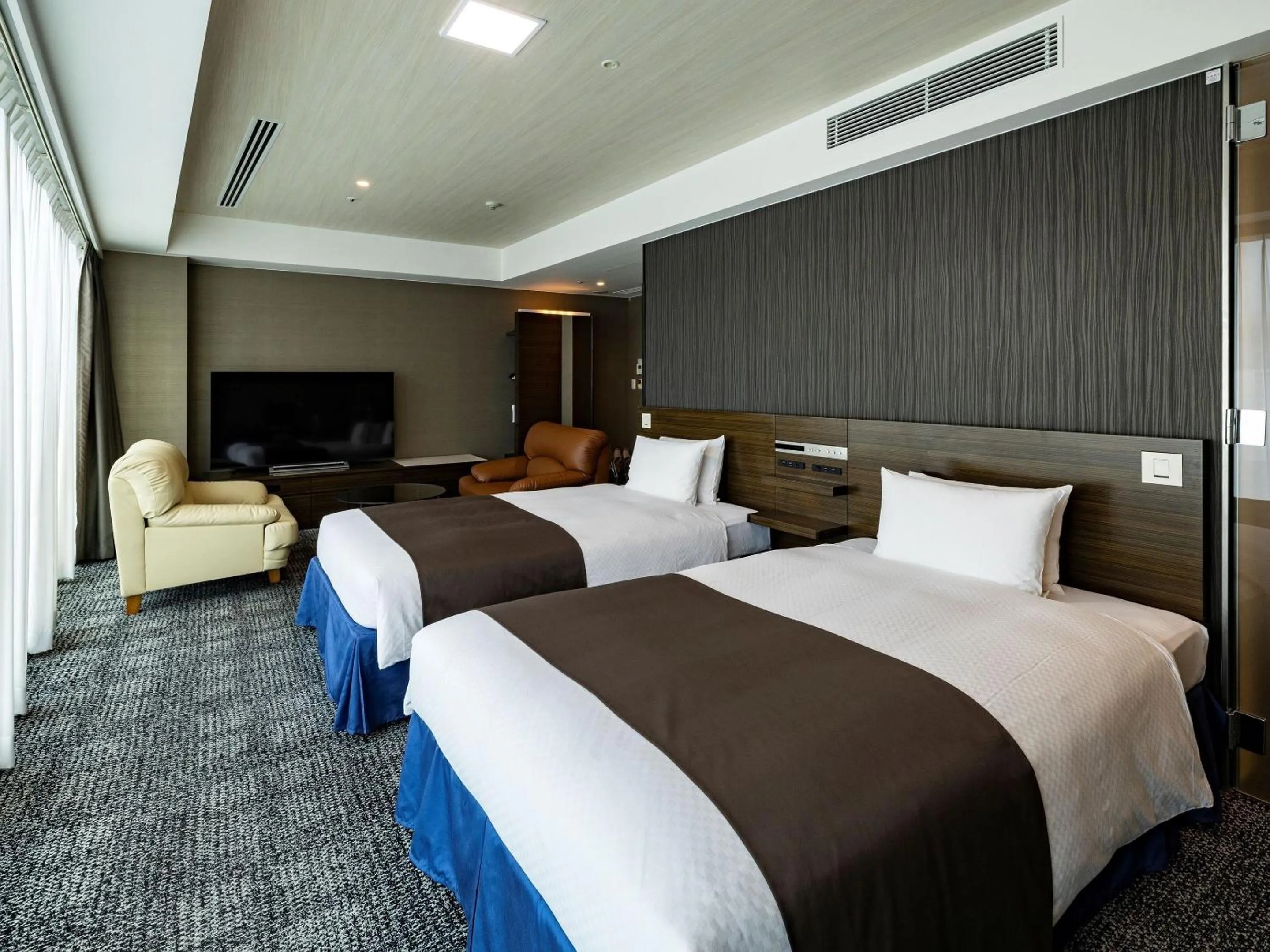 Photo of the whole room, Bed in KOKO HOTEL Premier Hakata - formerly Tenza Hotel at Hakata Station