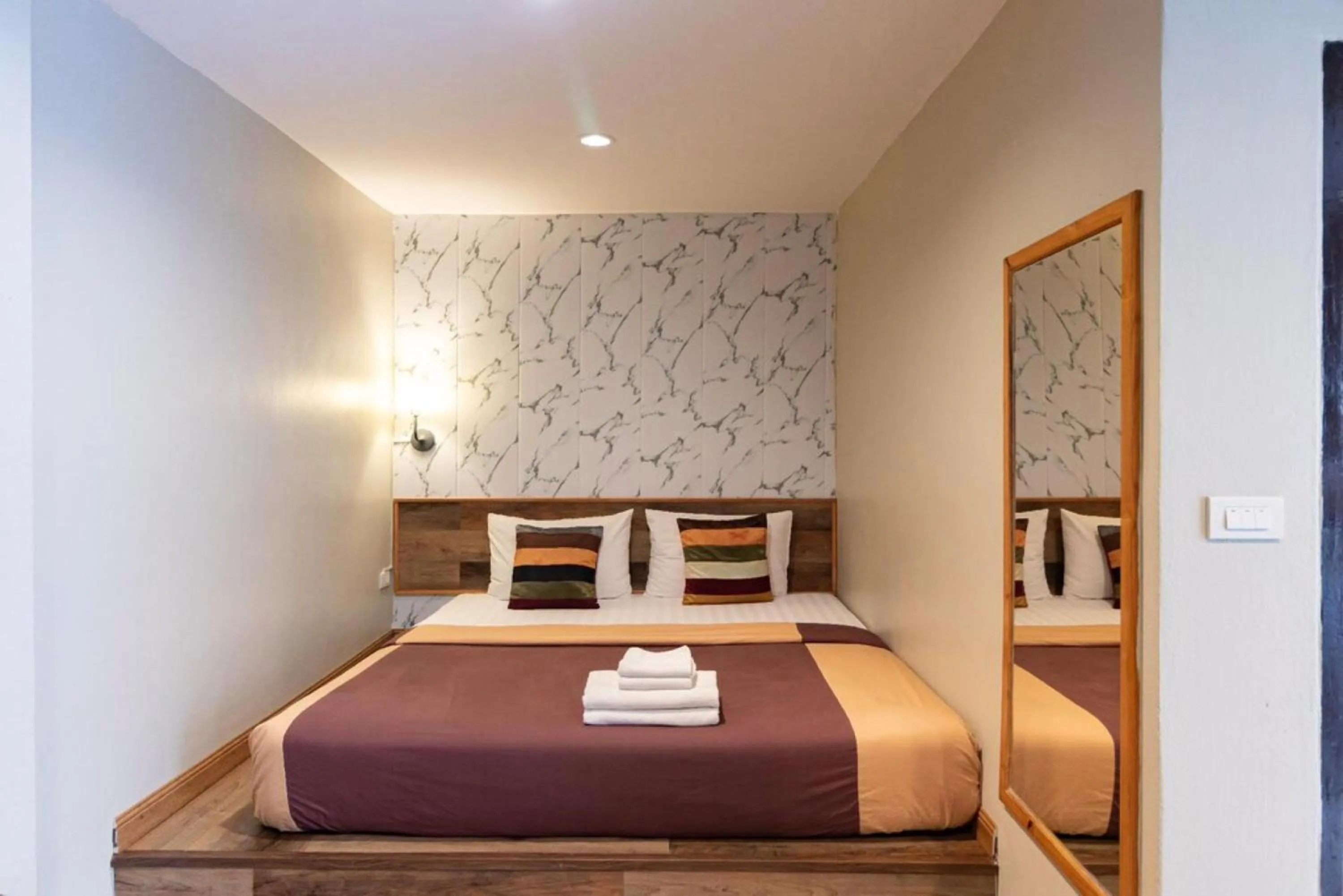 Bed in The Palm Hotel