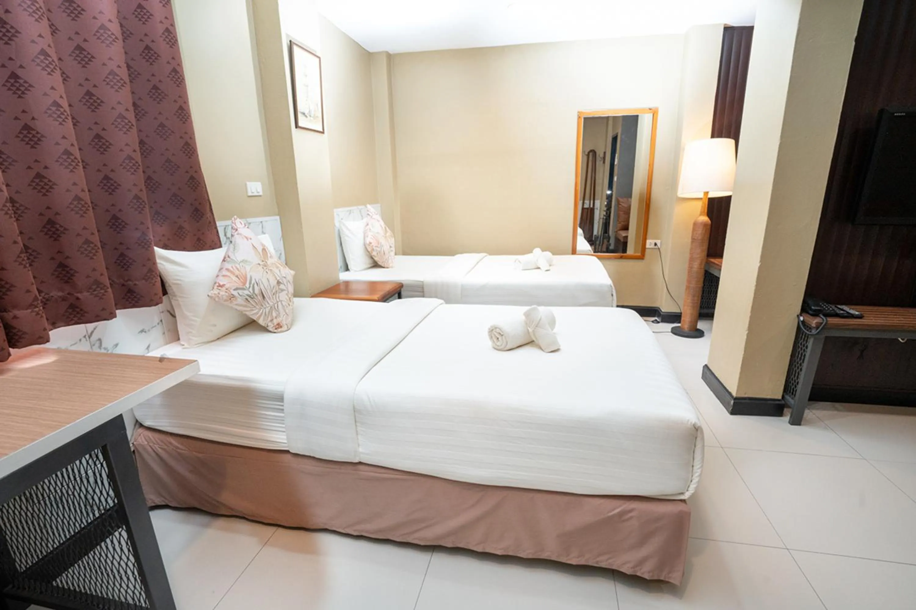 Bed in The Palm Hotel