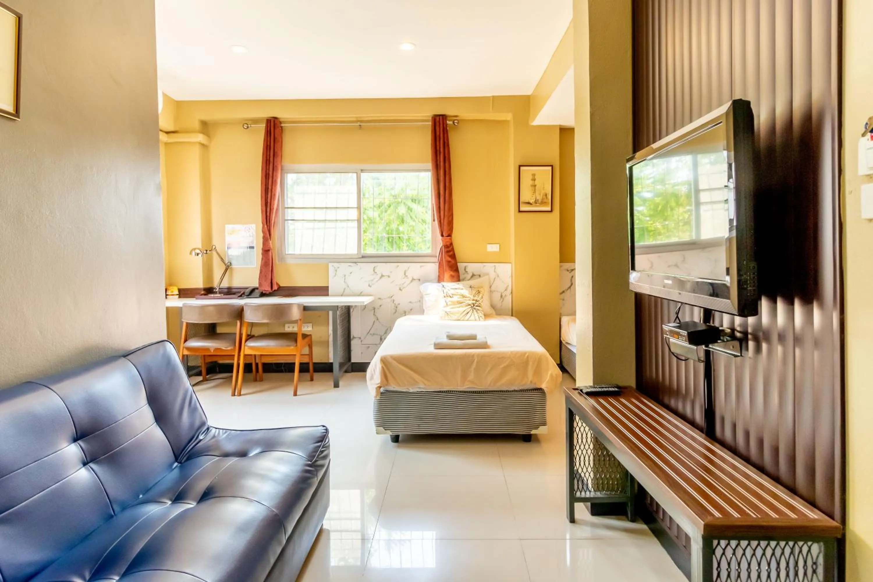 Bed in The Palm Hotel