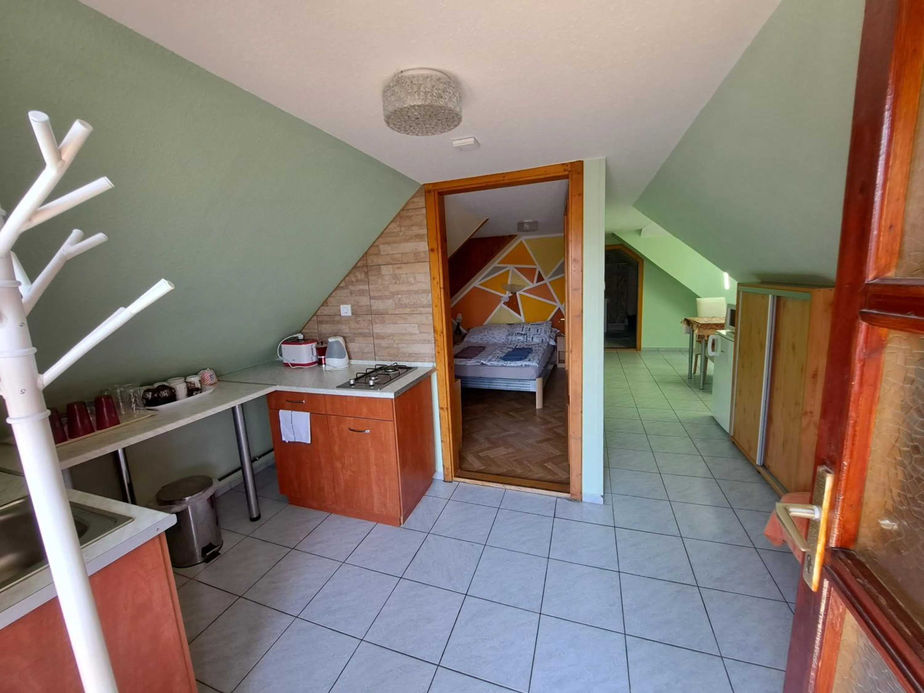 kitchen, Bed in Pink Tulip Apartment House