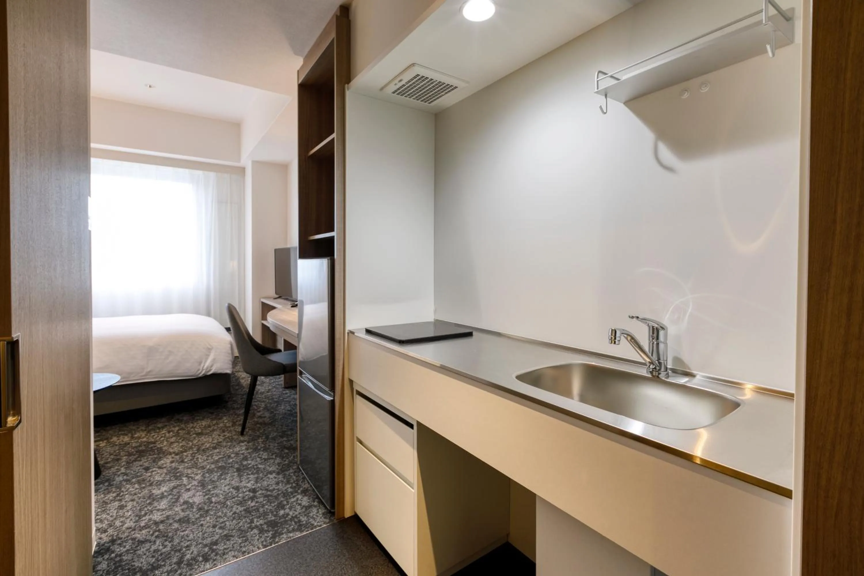 Kitchen or kitchenette, Bed in Glocal Hotel Itoshima