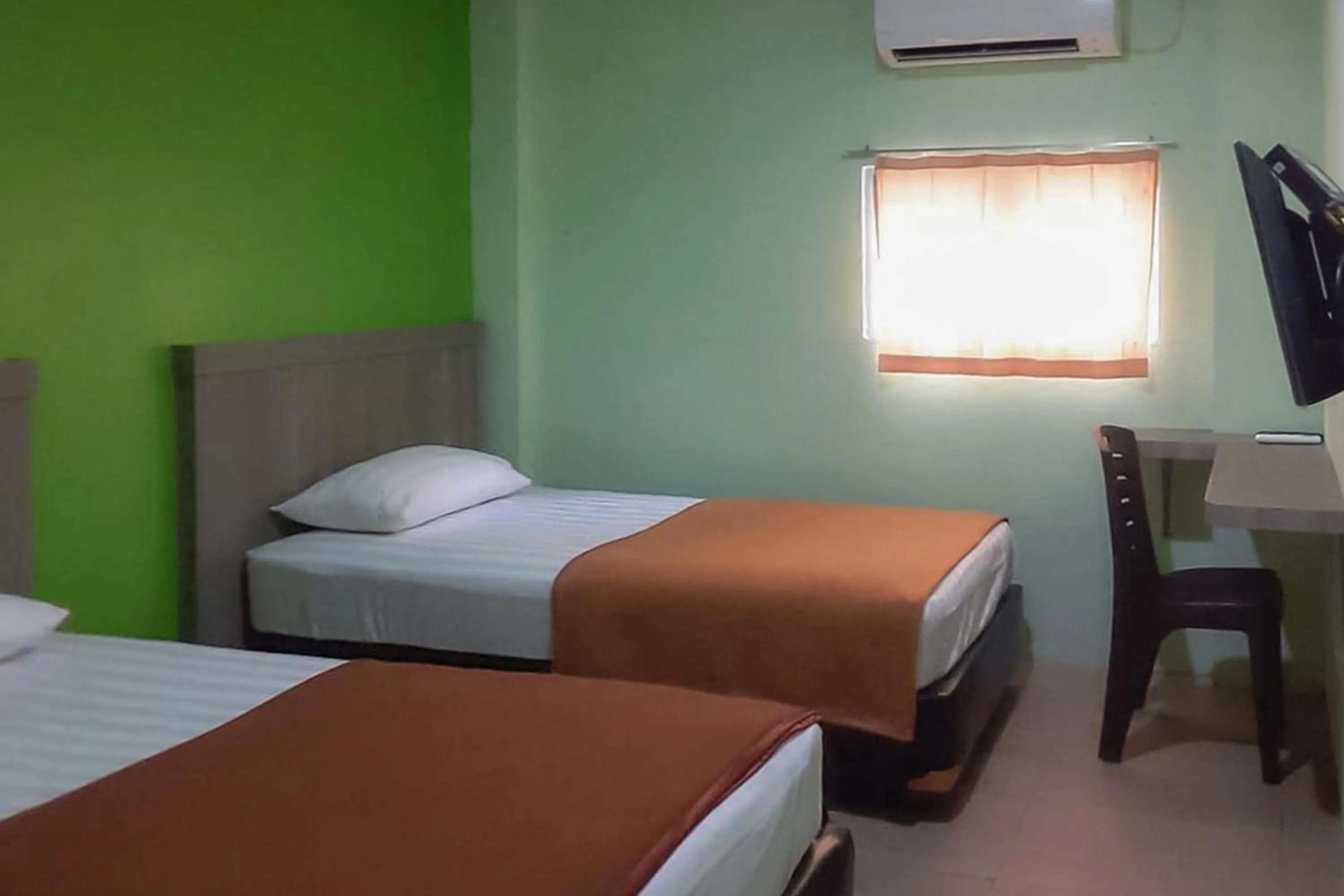 Bed in Guest House Anak Raja Pangkalan Bun Syariah Mitra RedDoorz
