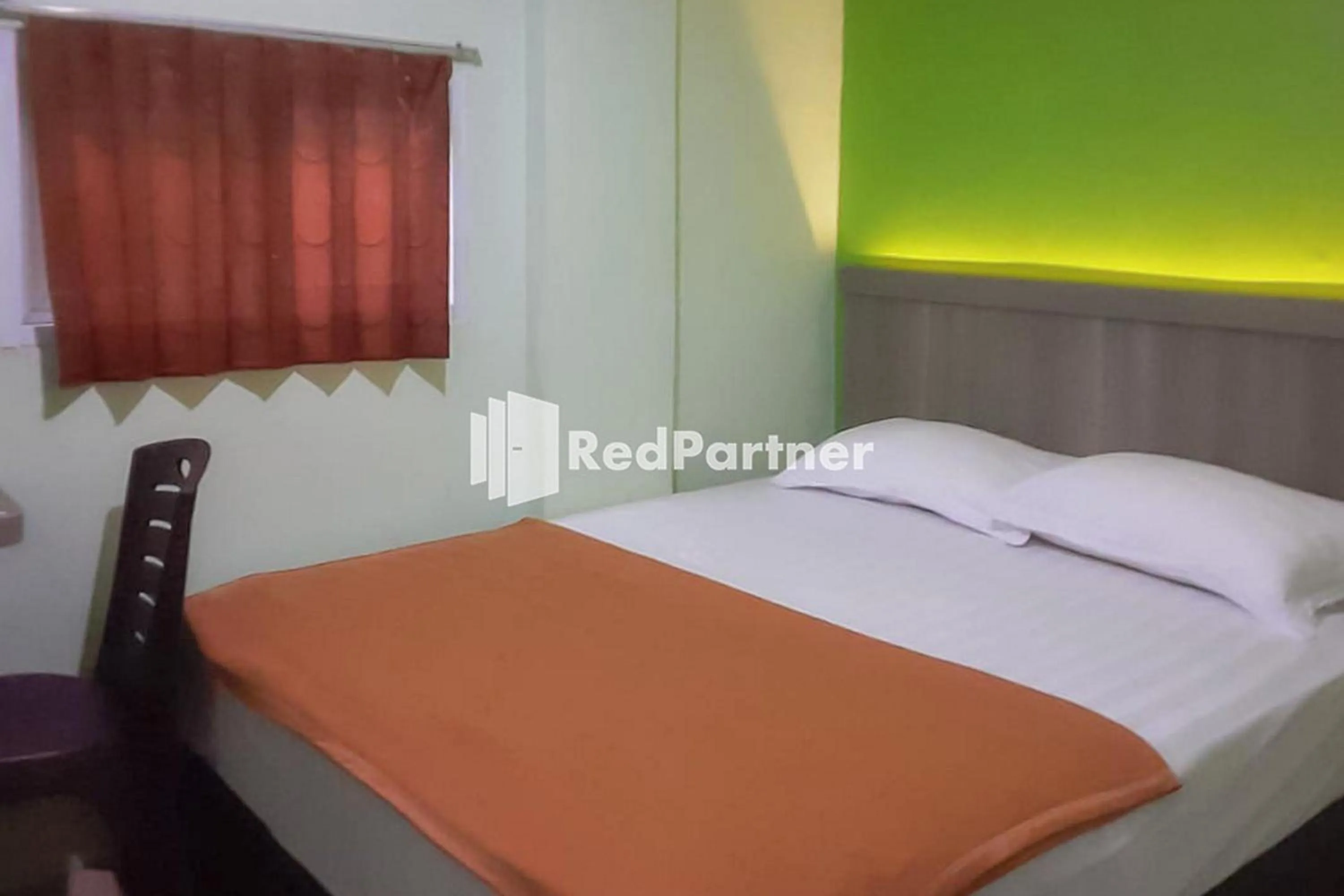 Bed in Guest House Anak Raja Pangkalan Bun Syariah Mitra RedDoorz