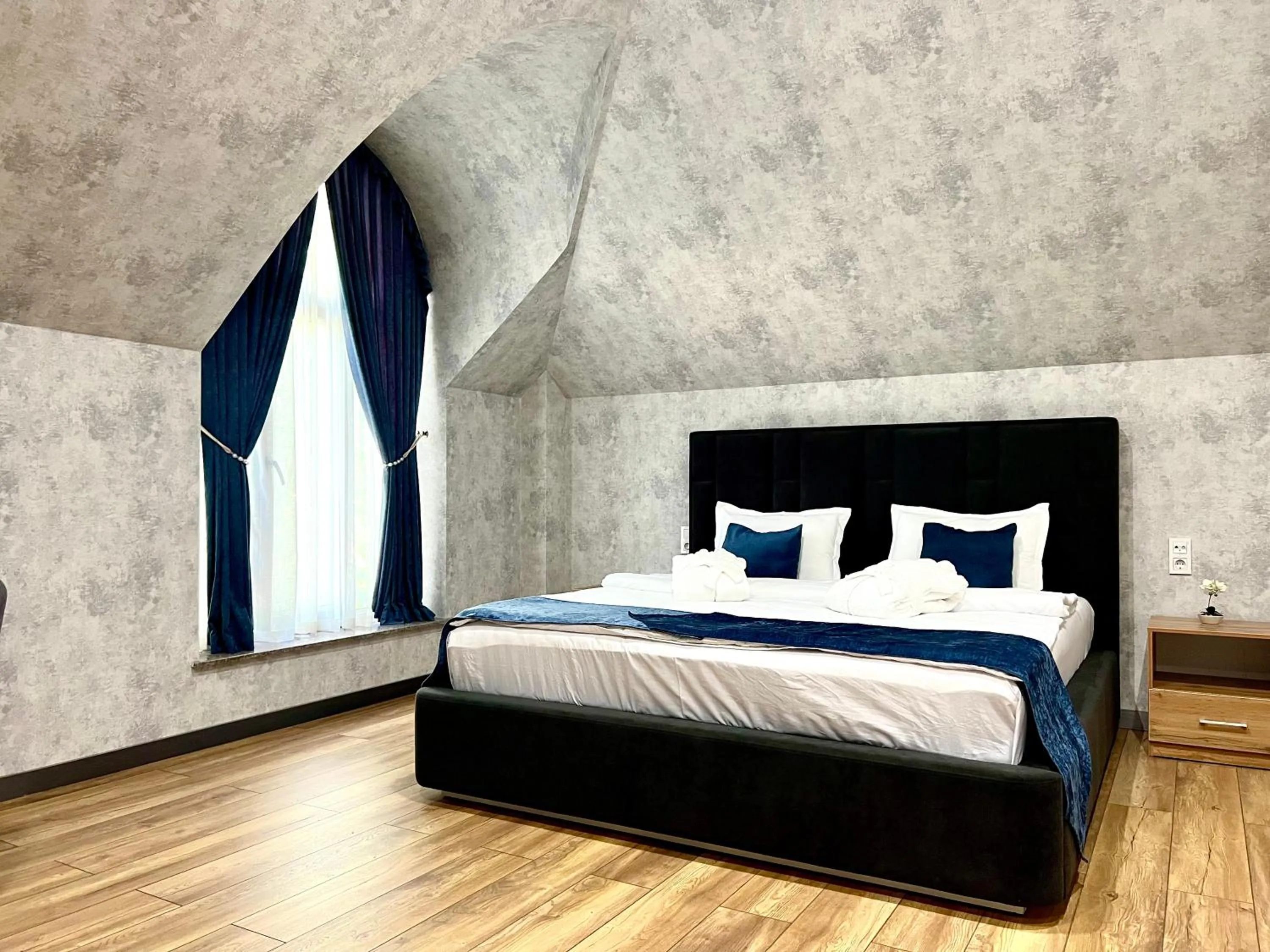 Bed in Alpha Plaza Hotel & SPA