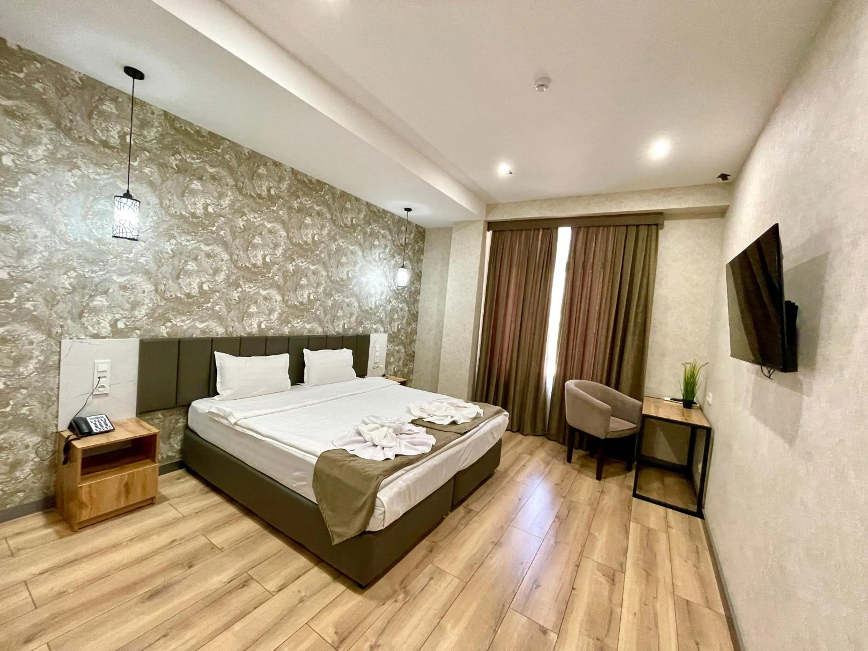 Bed in Alpha Plaza Hotel & SPA