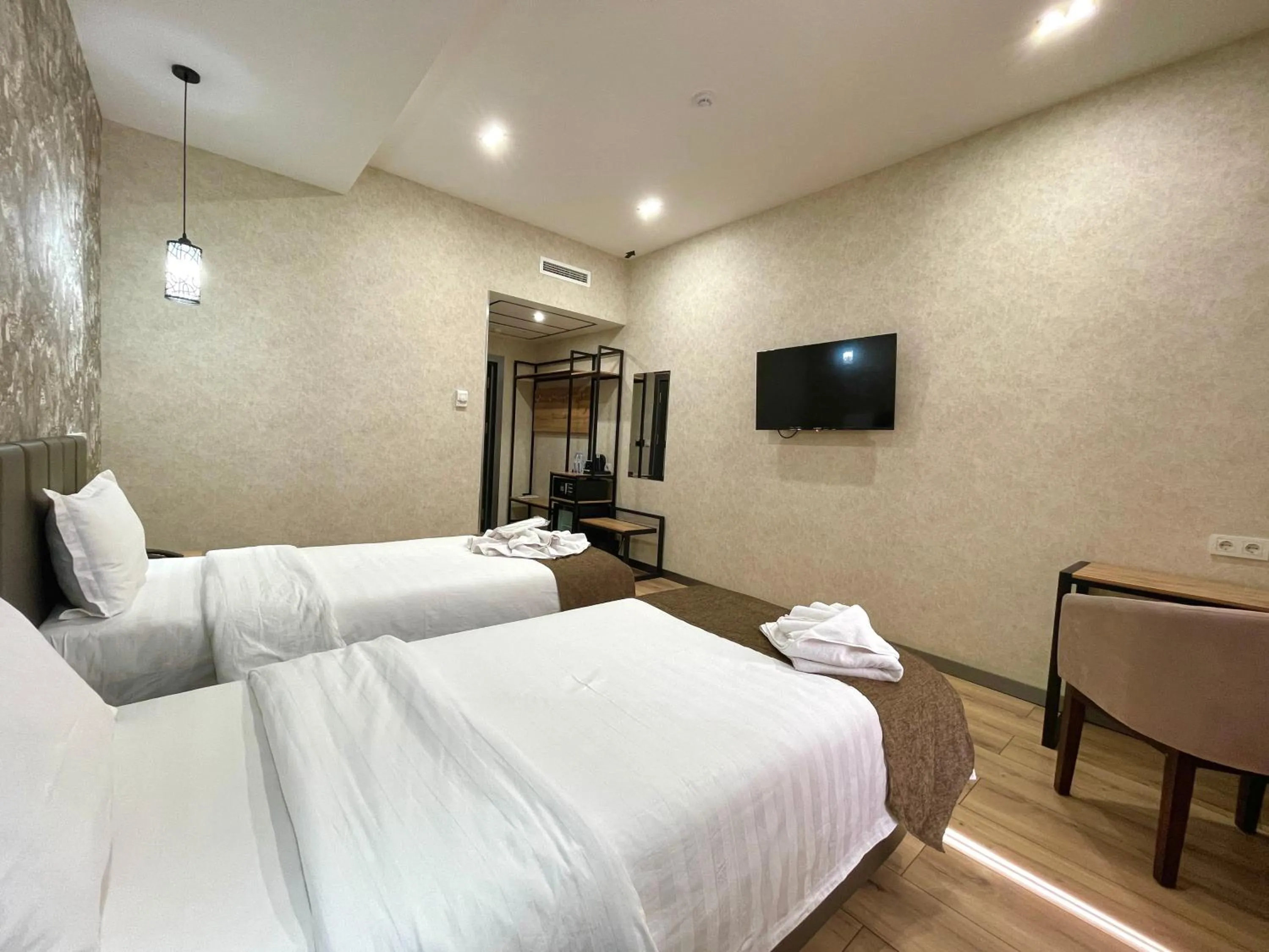 Bed in Alpha Plaza Hotel & SPA