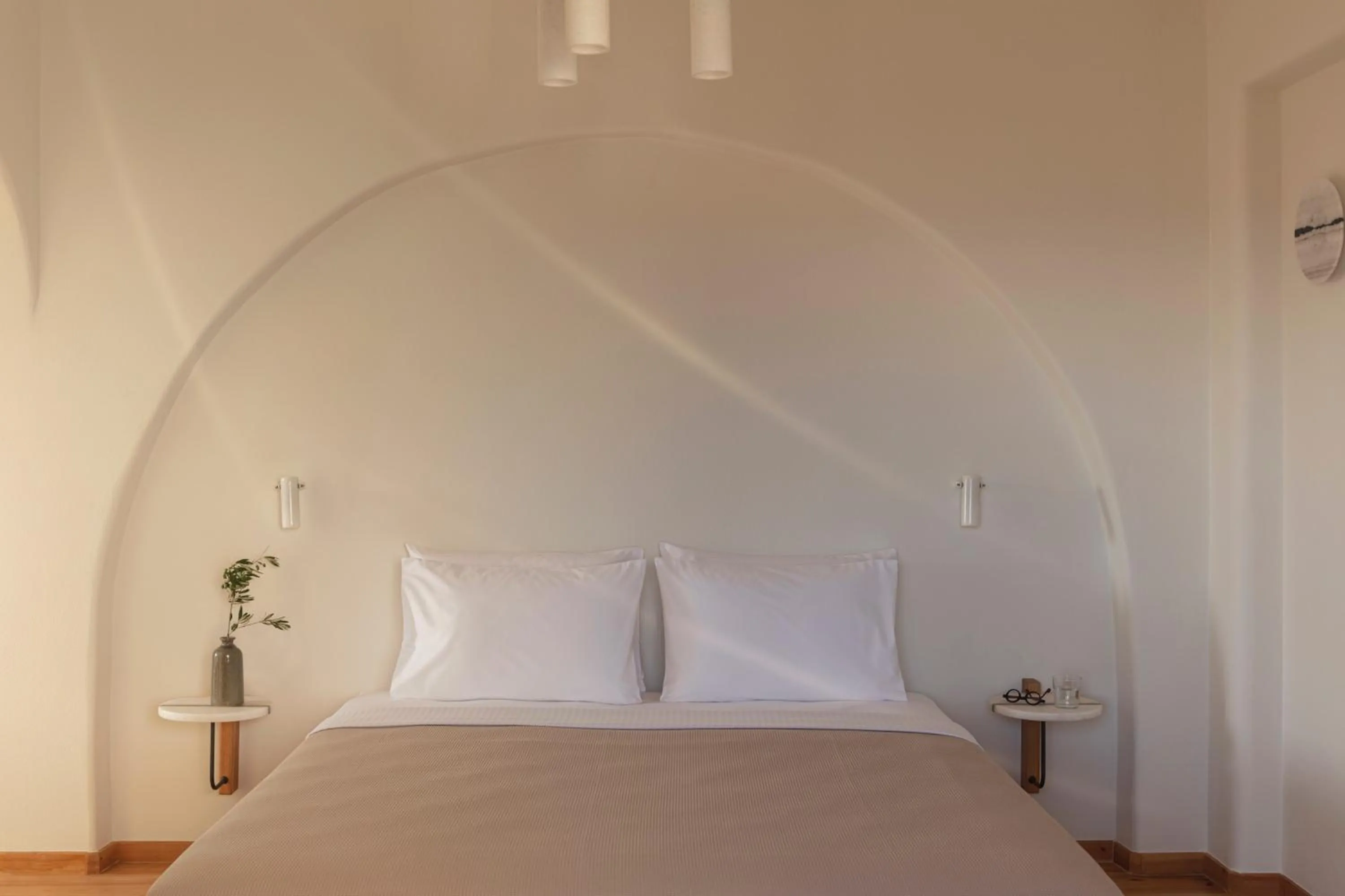 Bed in Ammothines Cycladic Suites