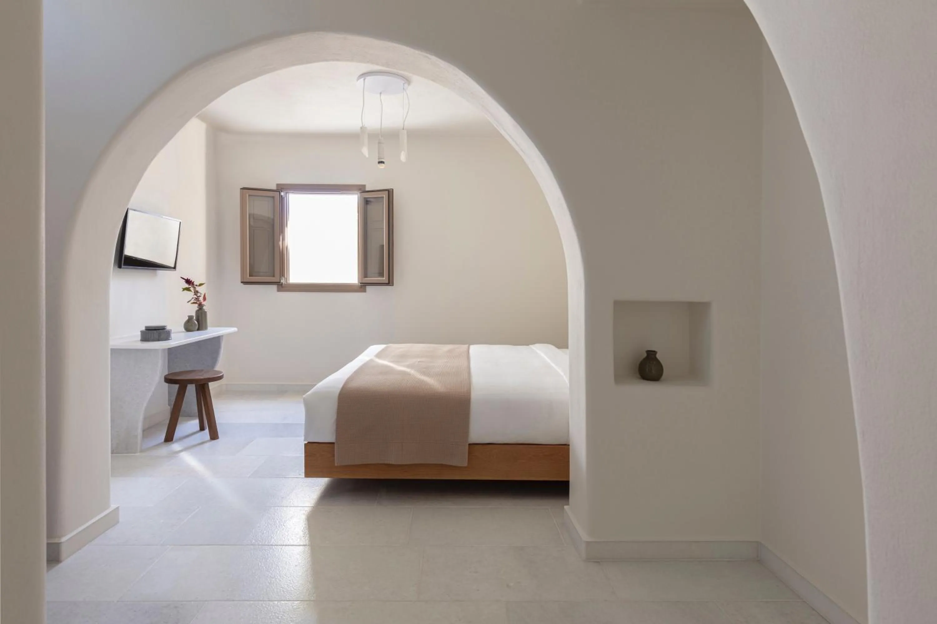 Bed in Ammothines Cycladic Suites