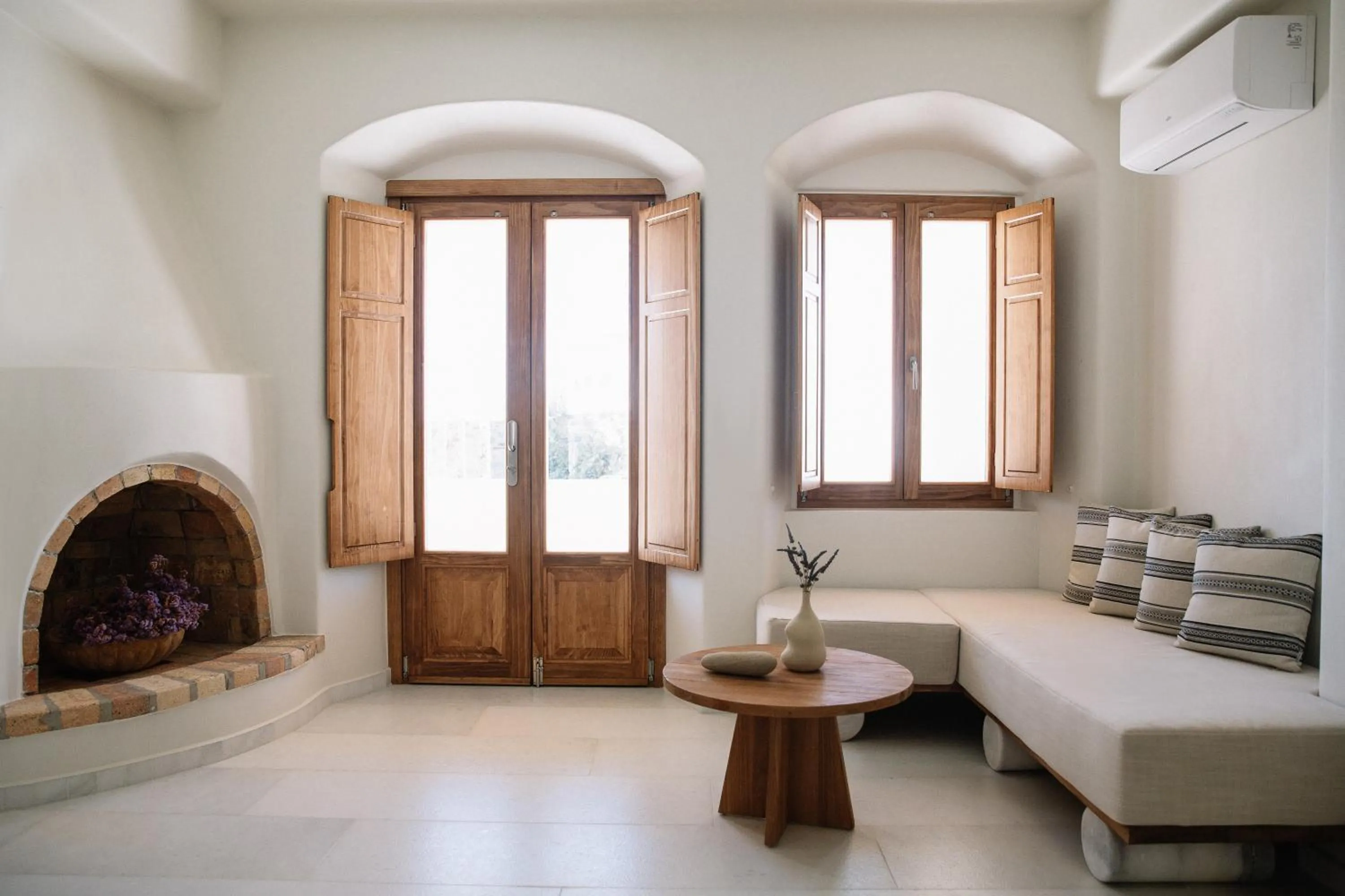 Seating area, Bed in Ammothines Cycladic Suites