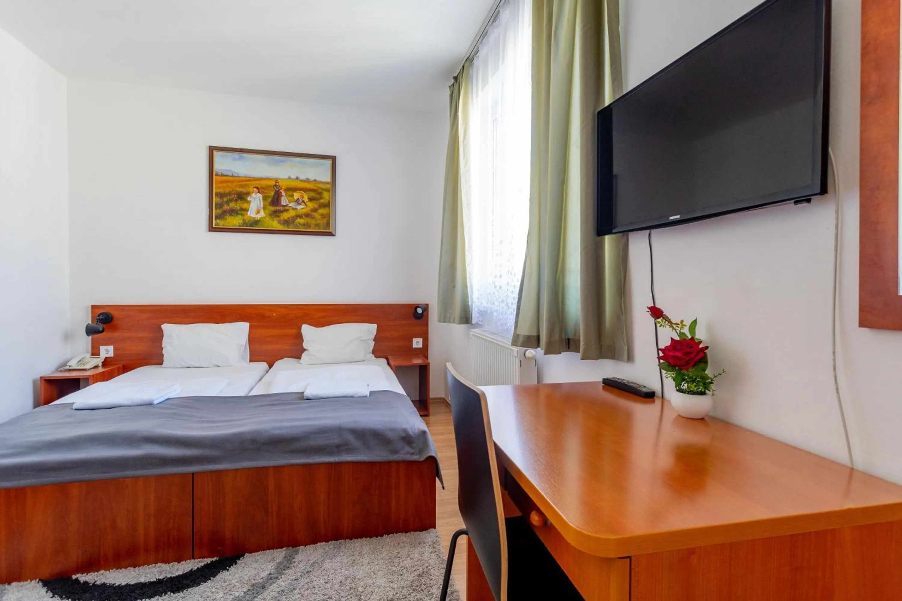 Bed in Triple M Hotel