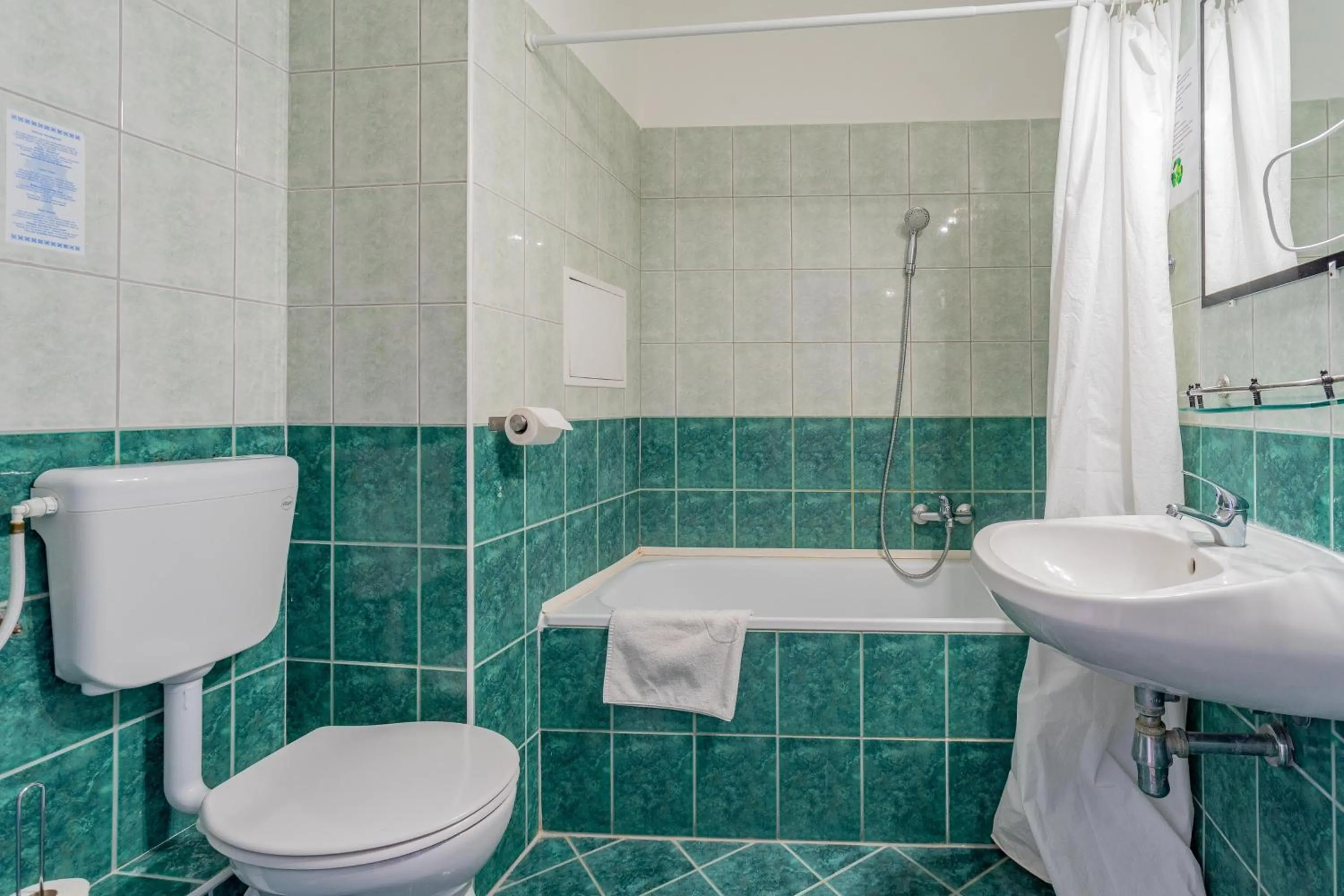 Toilet in Triple M Hotel