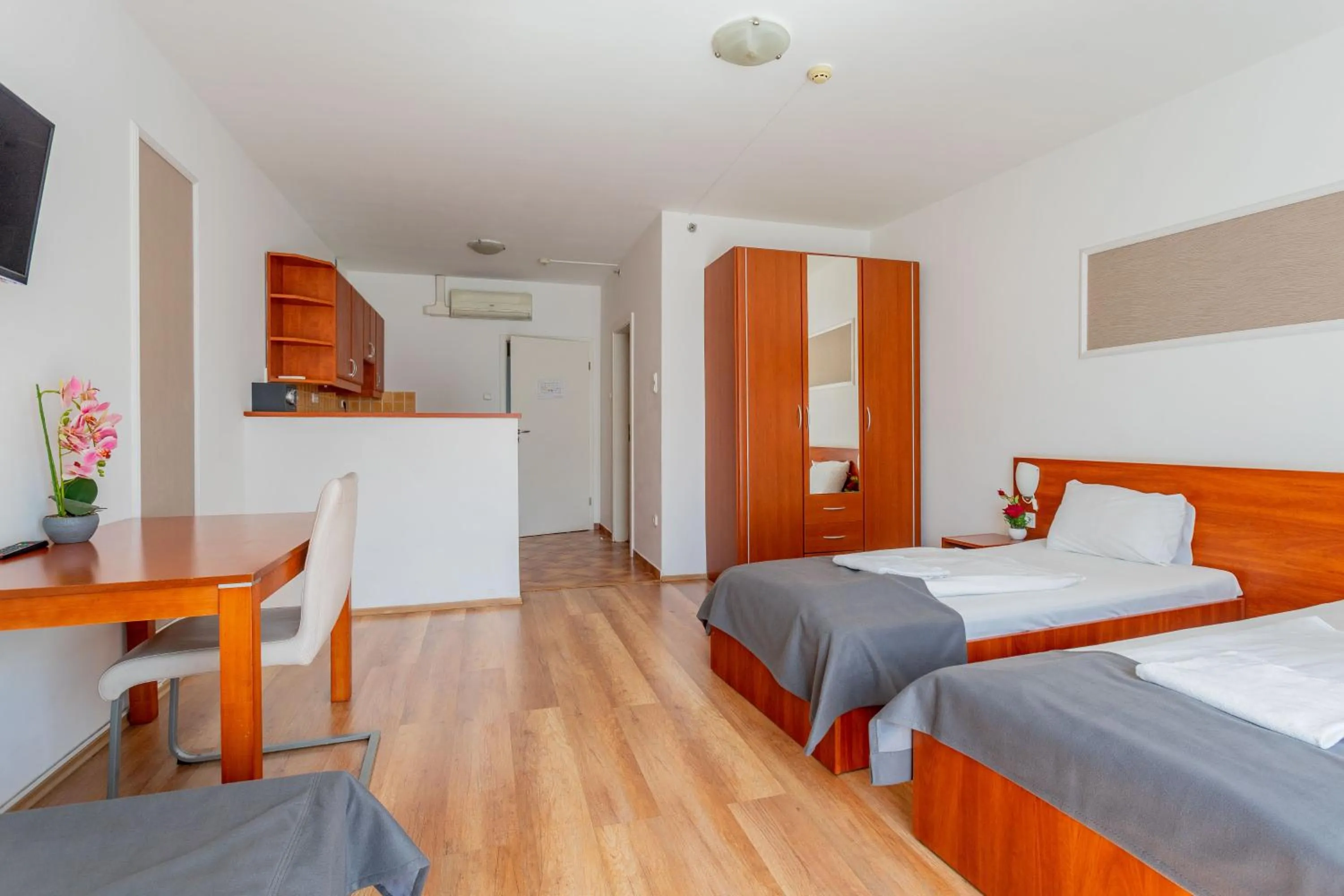 Bed in Triple M Hotel