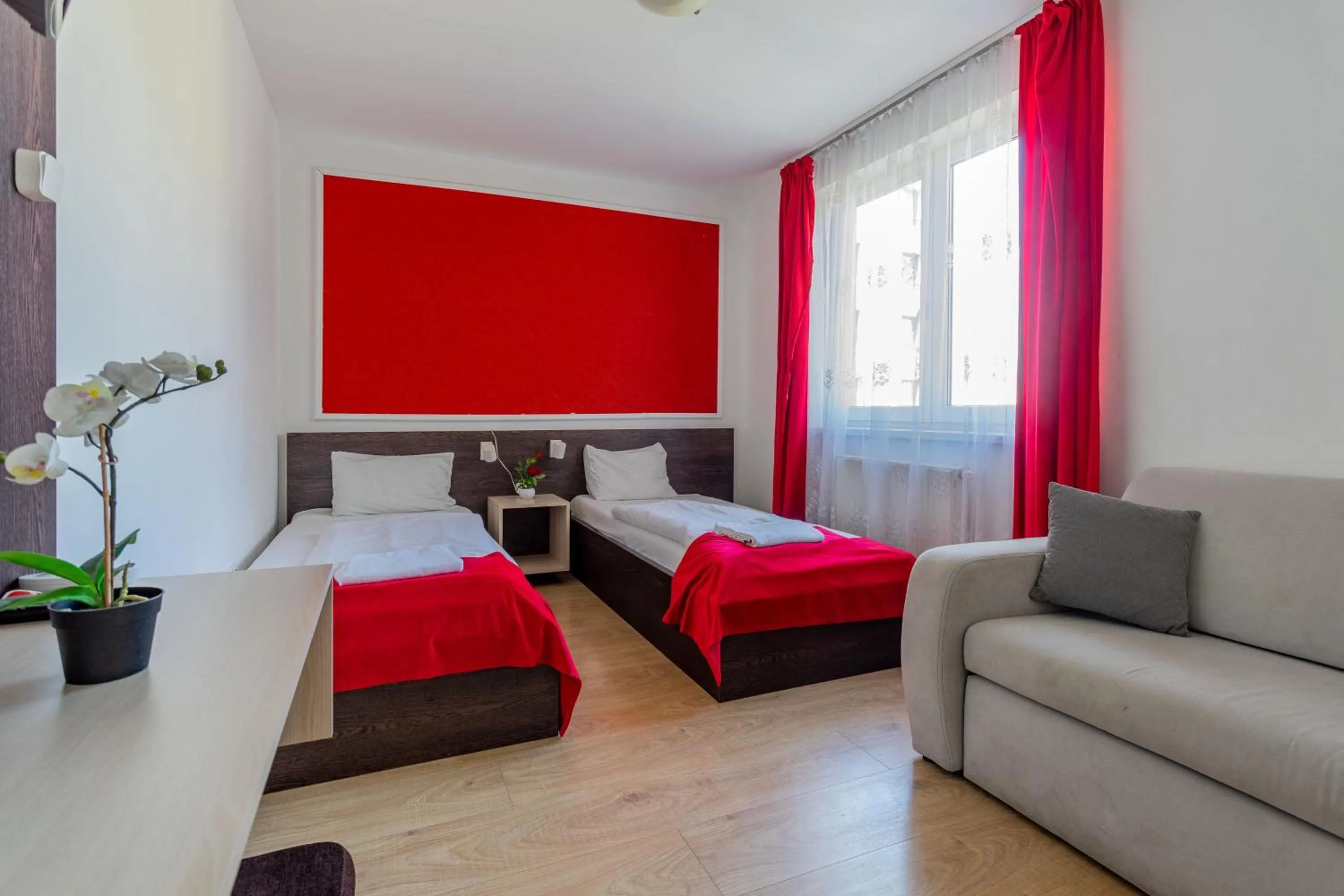 Bed in Triple M Hotel