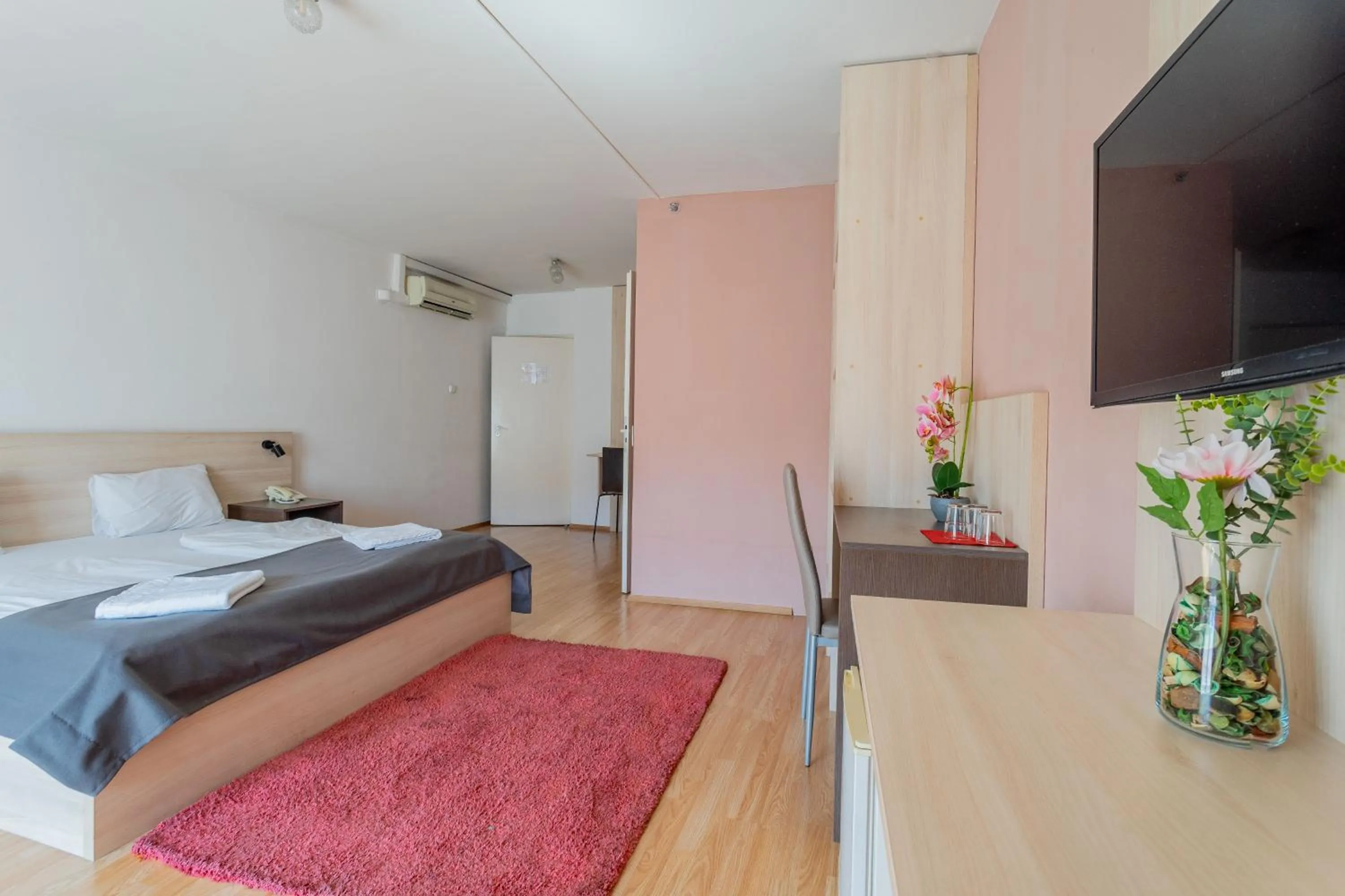 Bed in Triple M Hotel