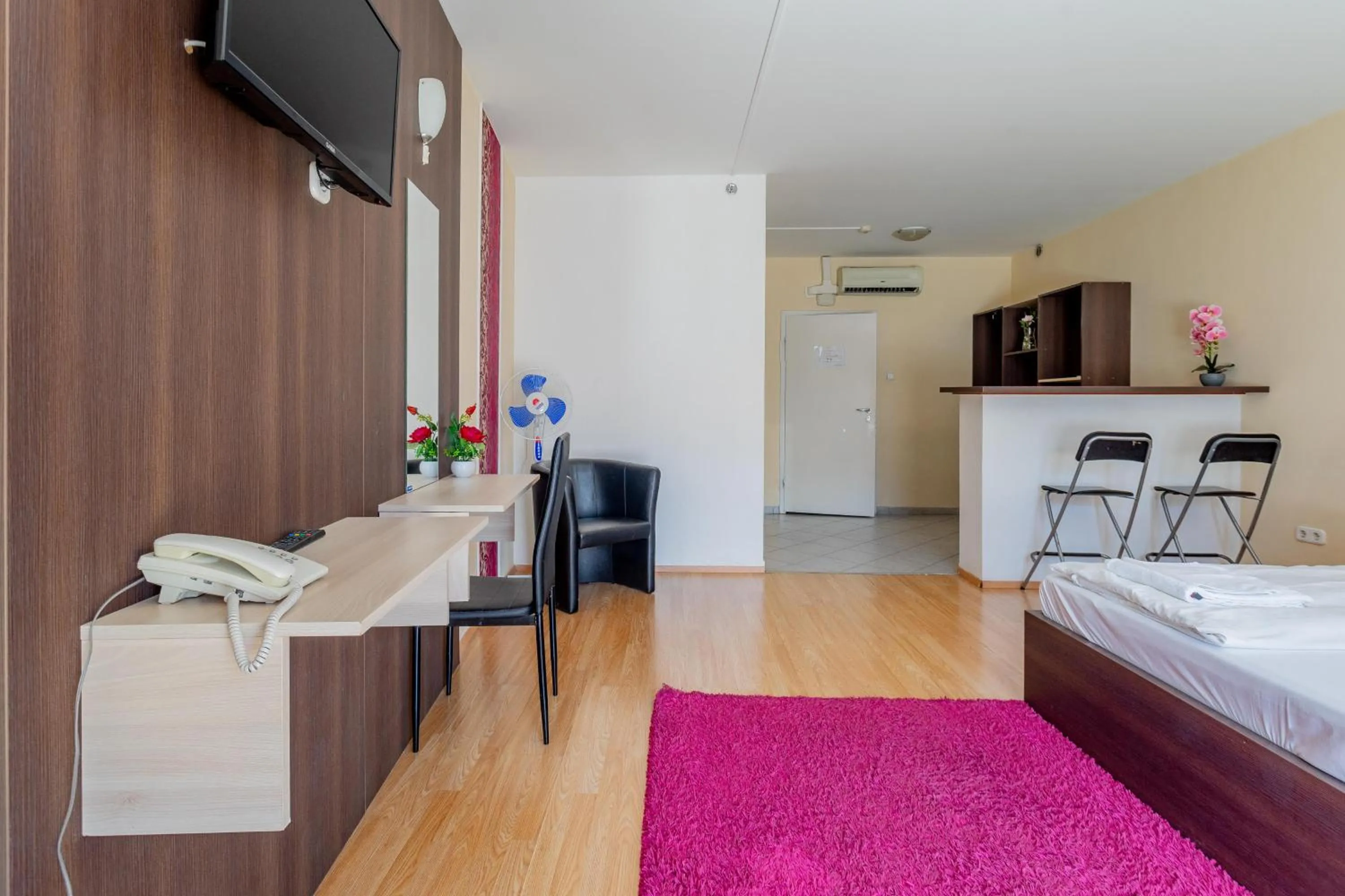 Bed in Triple M Hotel