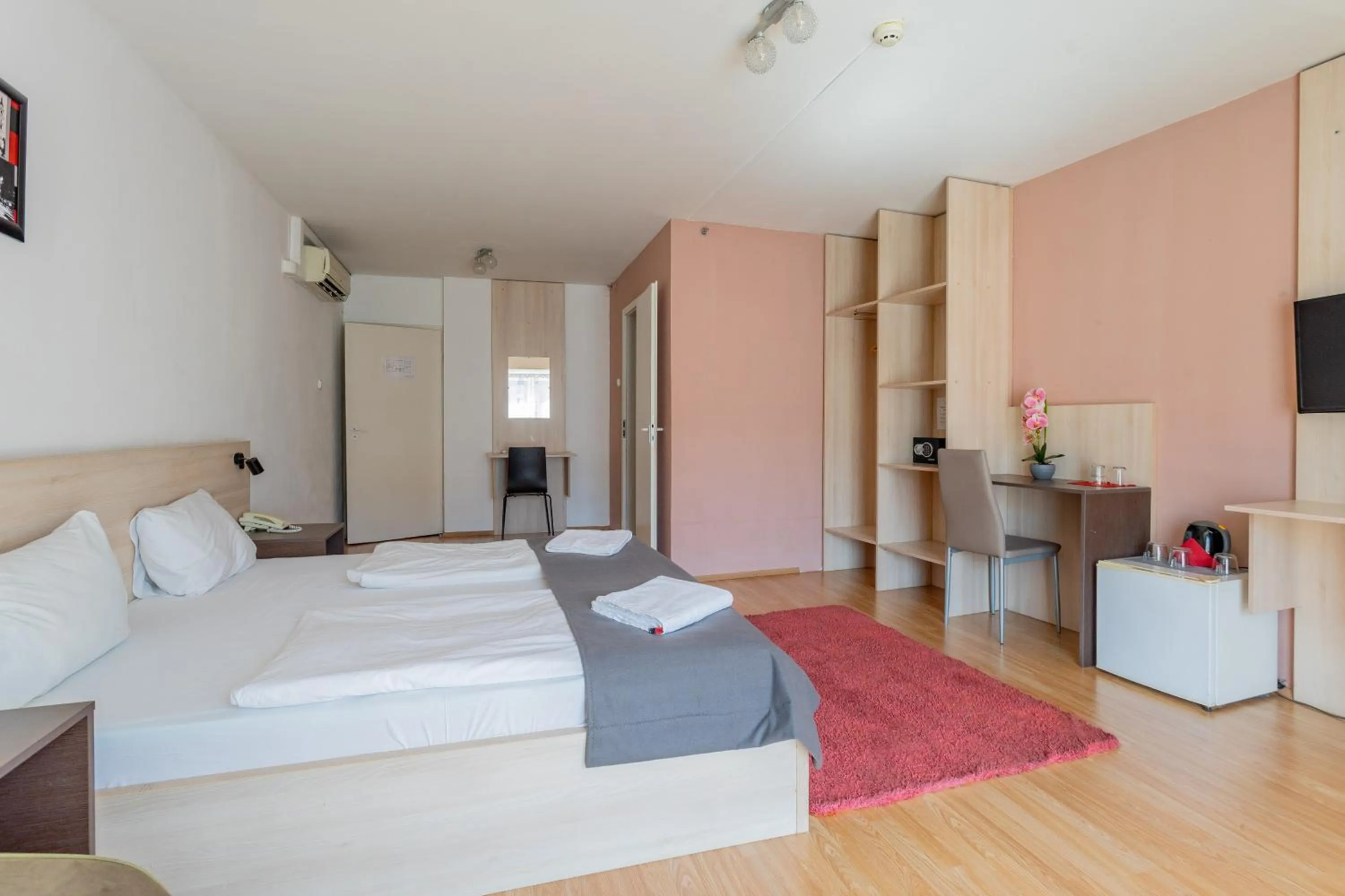 Bed in Triple M Hotel