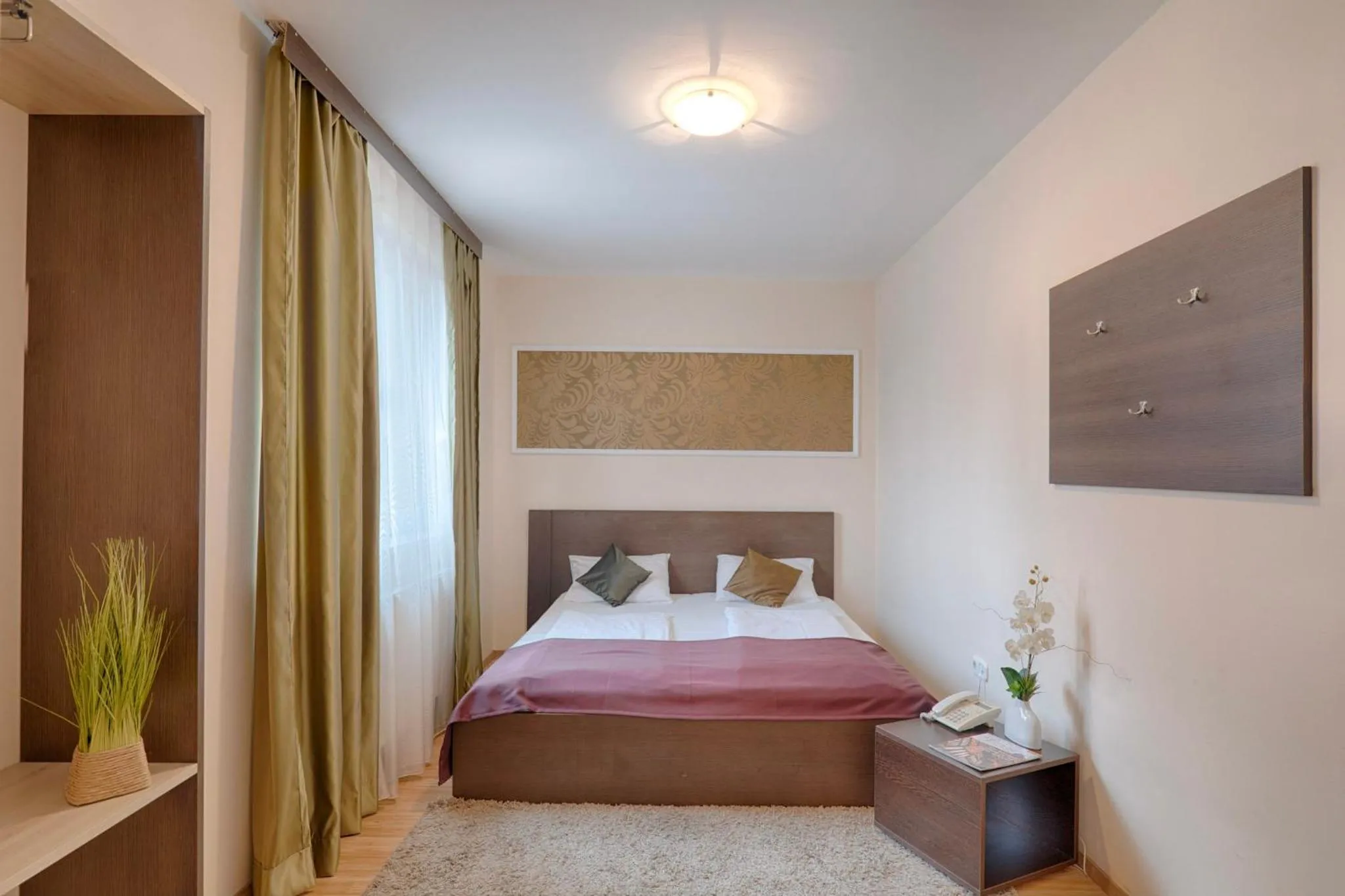 Bed in Triple M Hotel