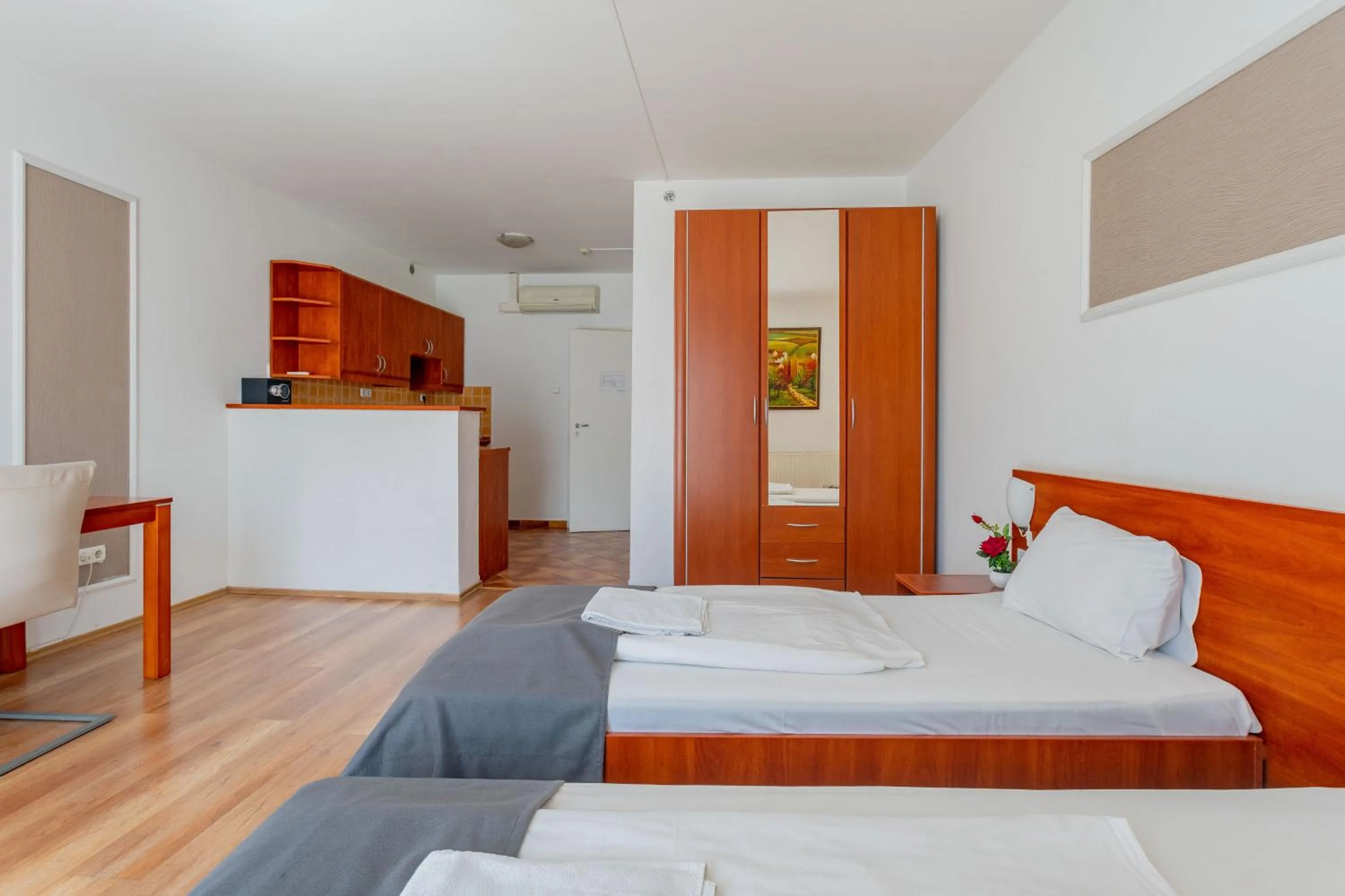 Bed in Triple M Hotel