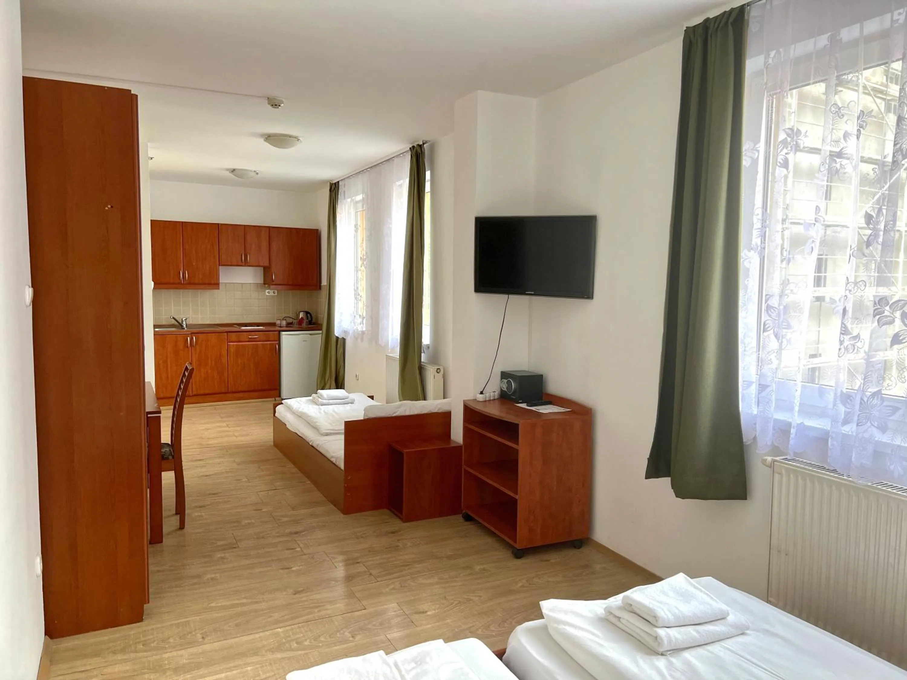 Bed in Triple M Hotel