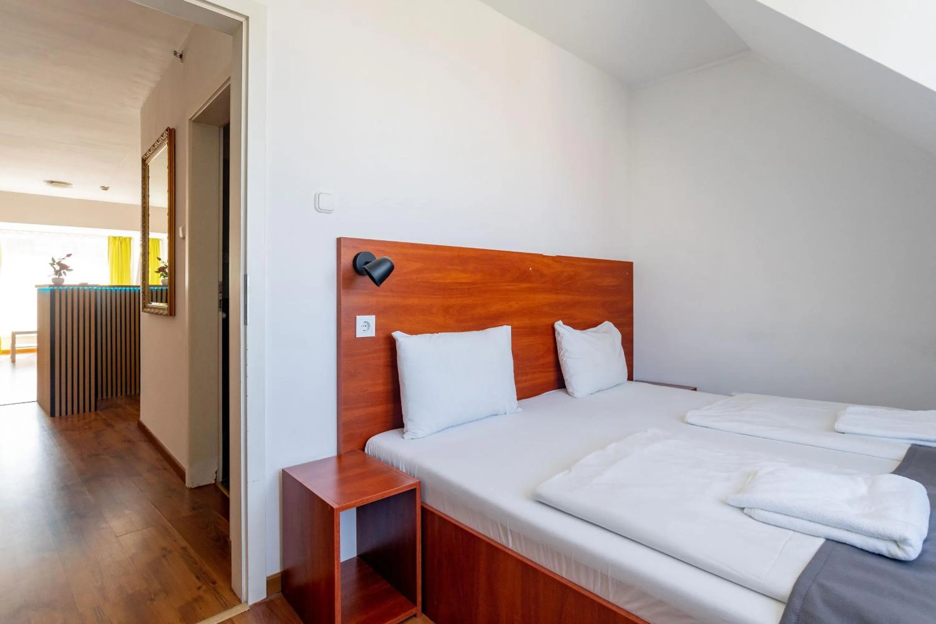 Bed in Triple M Hotel