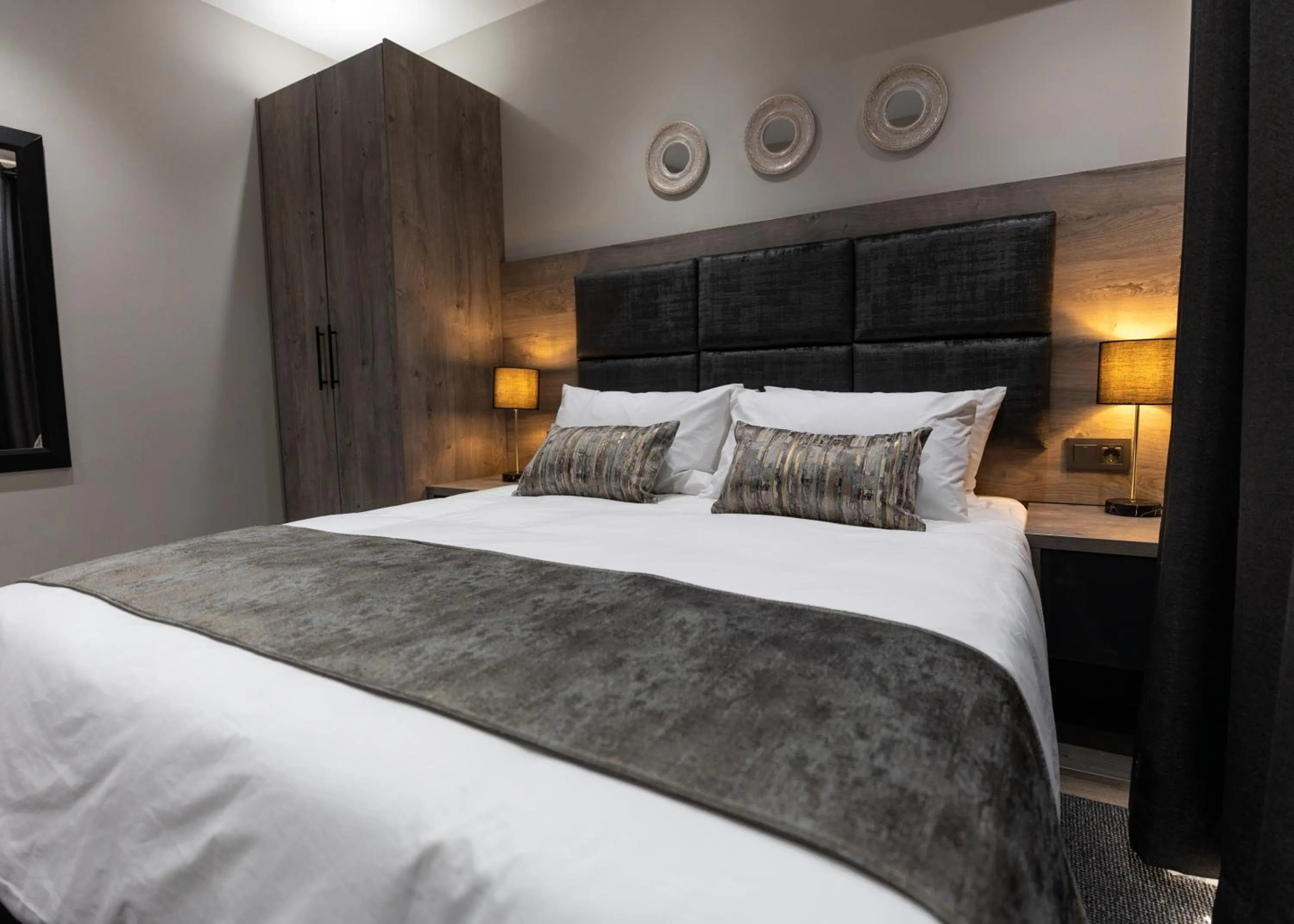 Bed in Luxe Suites Boutique Hotel