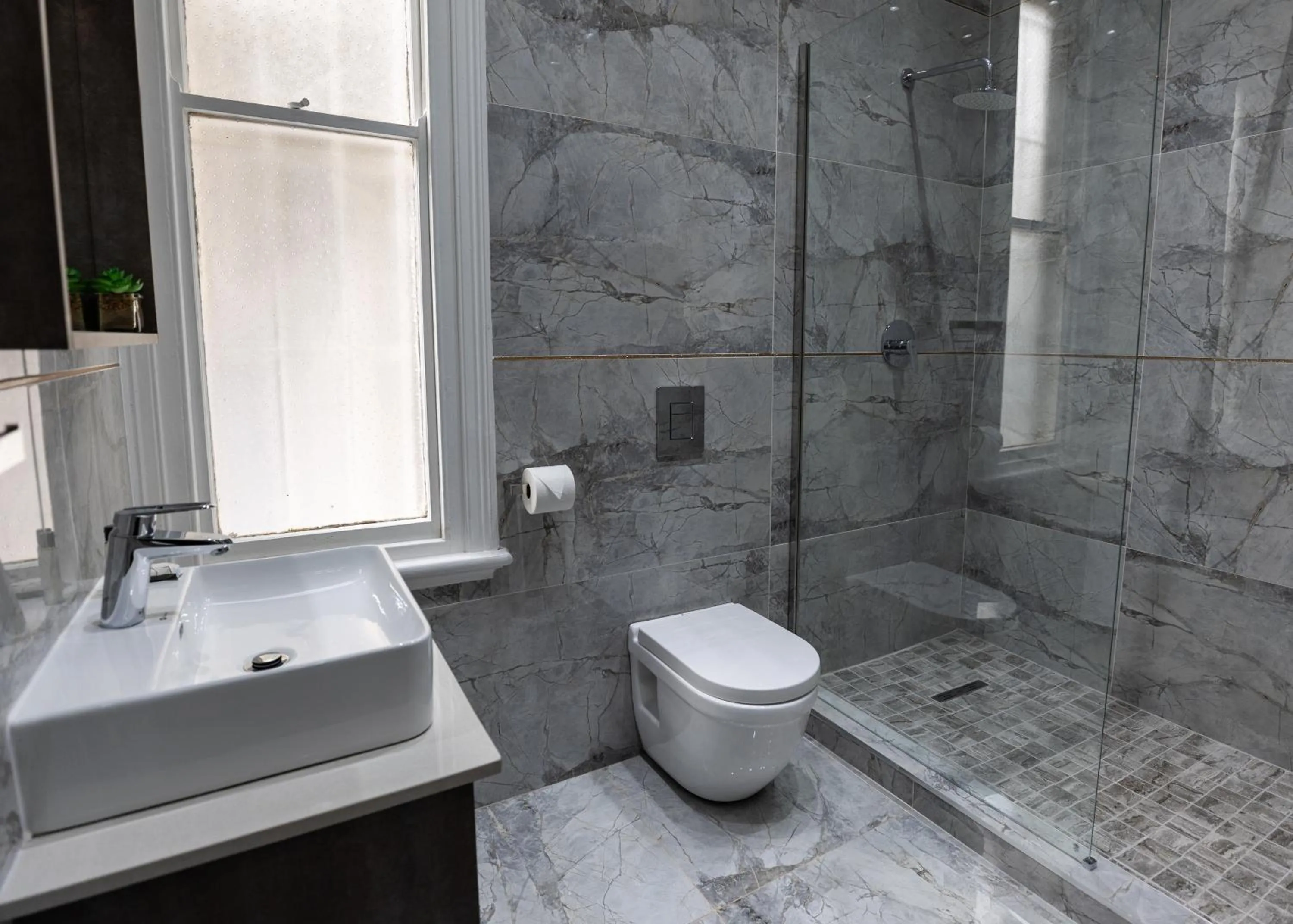 Bathroom in Luxe Suites Boutique Hotel