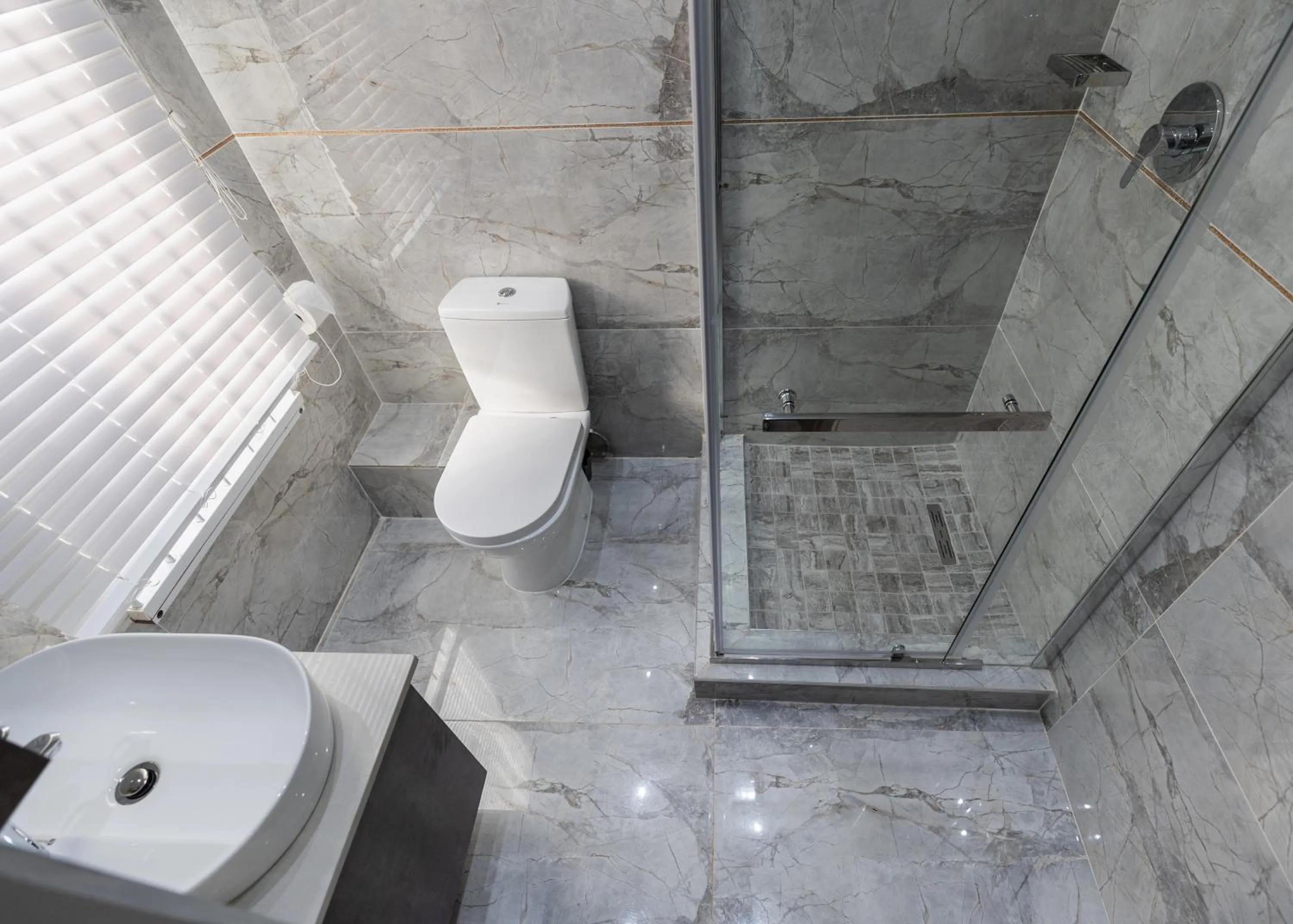 Bathroom in Luxe Suites Boutique Hotel