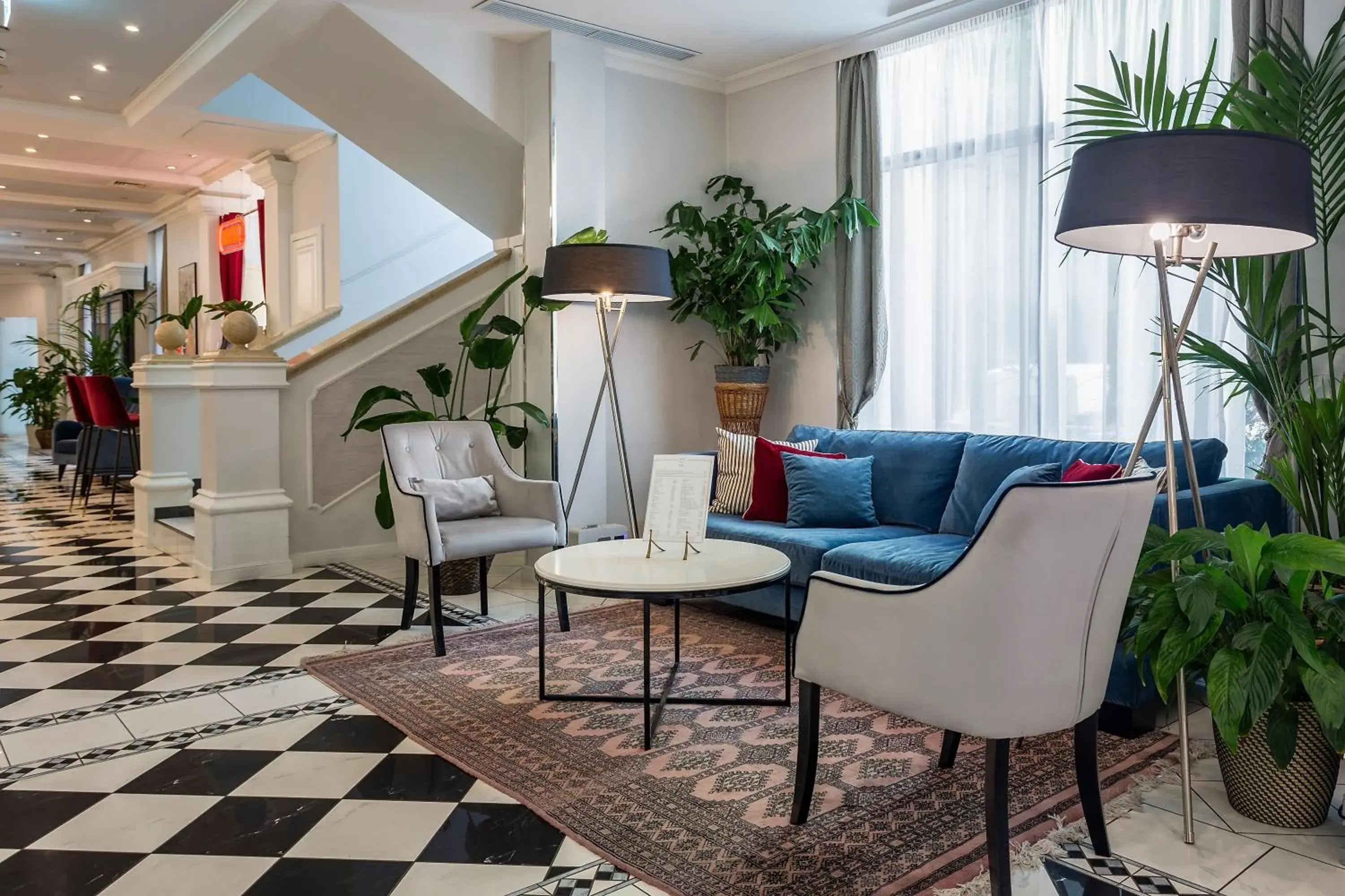 Lobby or reception in Queen's Court Hotel & Residence Lobby or reception in Queen's Court Hotel & Residence