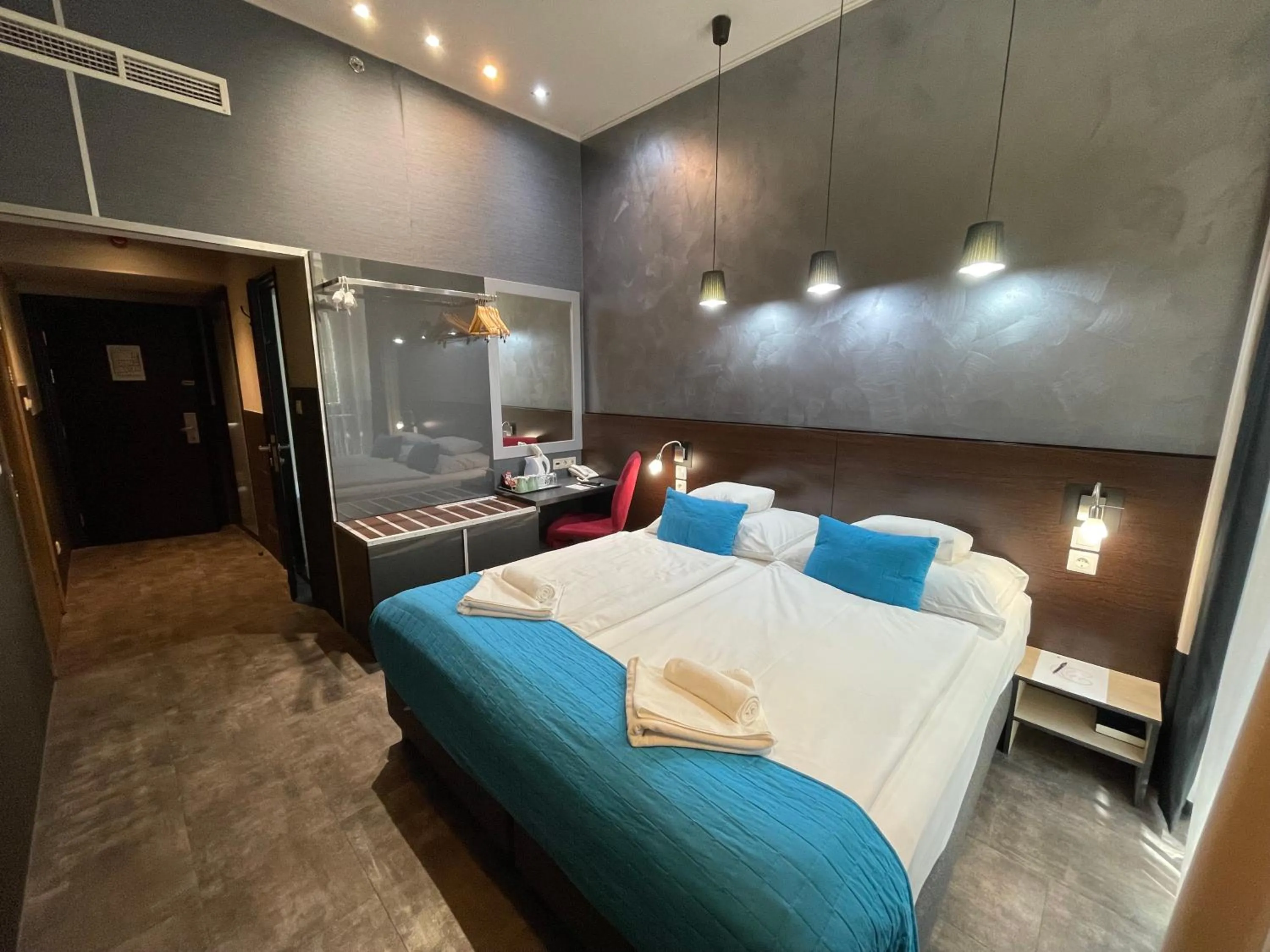 Bed in Carat Boutique Hotel