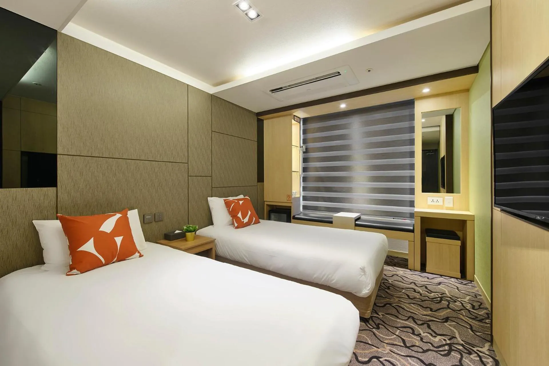 Bed in Jeju Grace Hotel