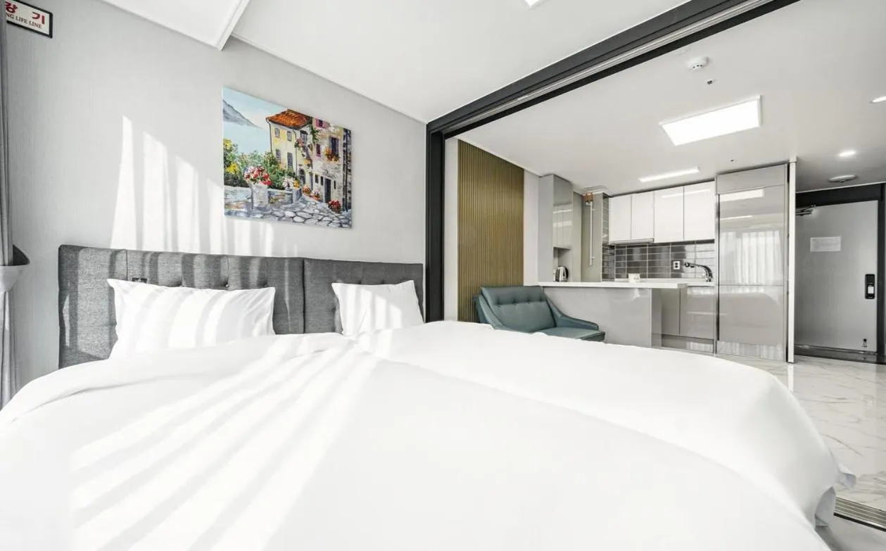 Bed in Songjeong Blue Castle Hotel