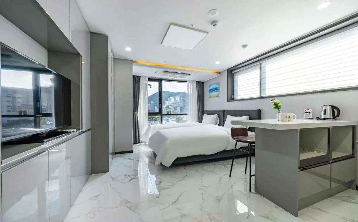 Bed in Songjeong Blue Castle Hotel