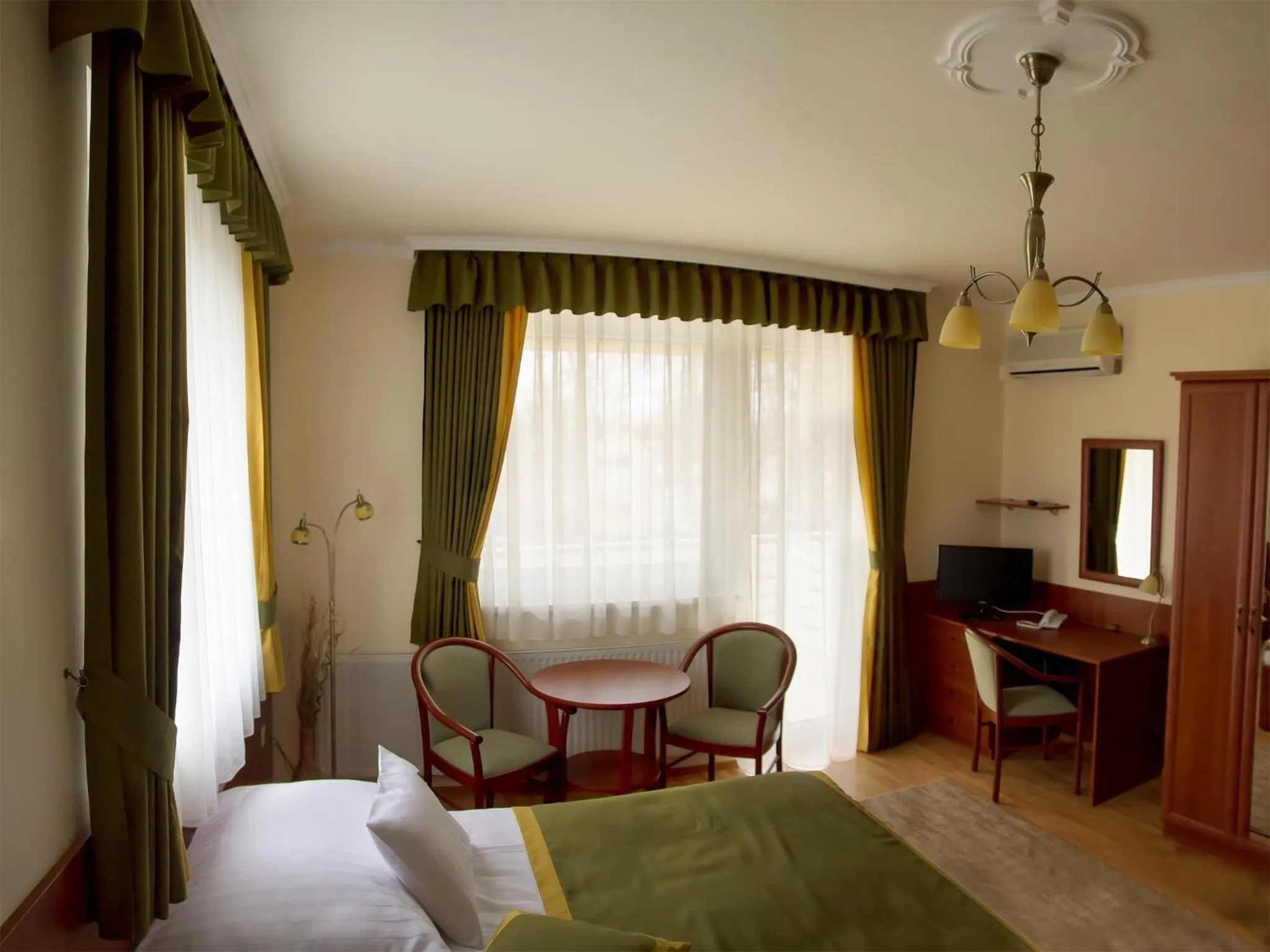 Bed in Apartman Bella Hotel