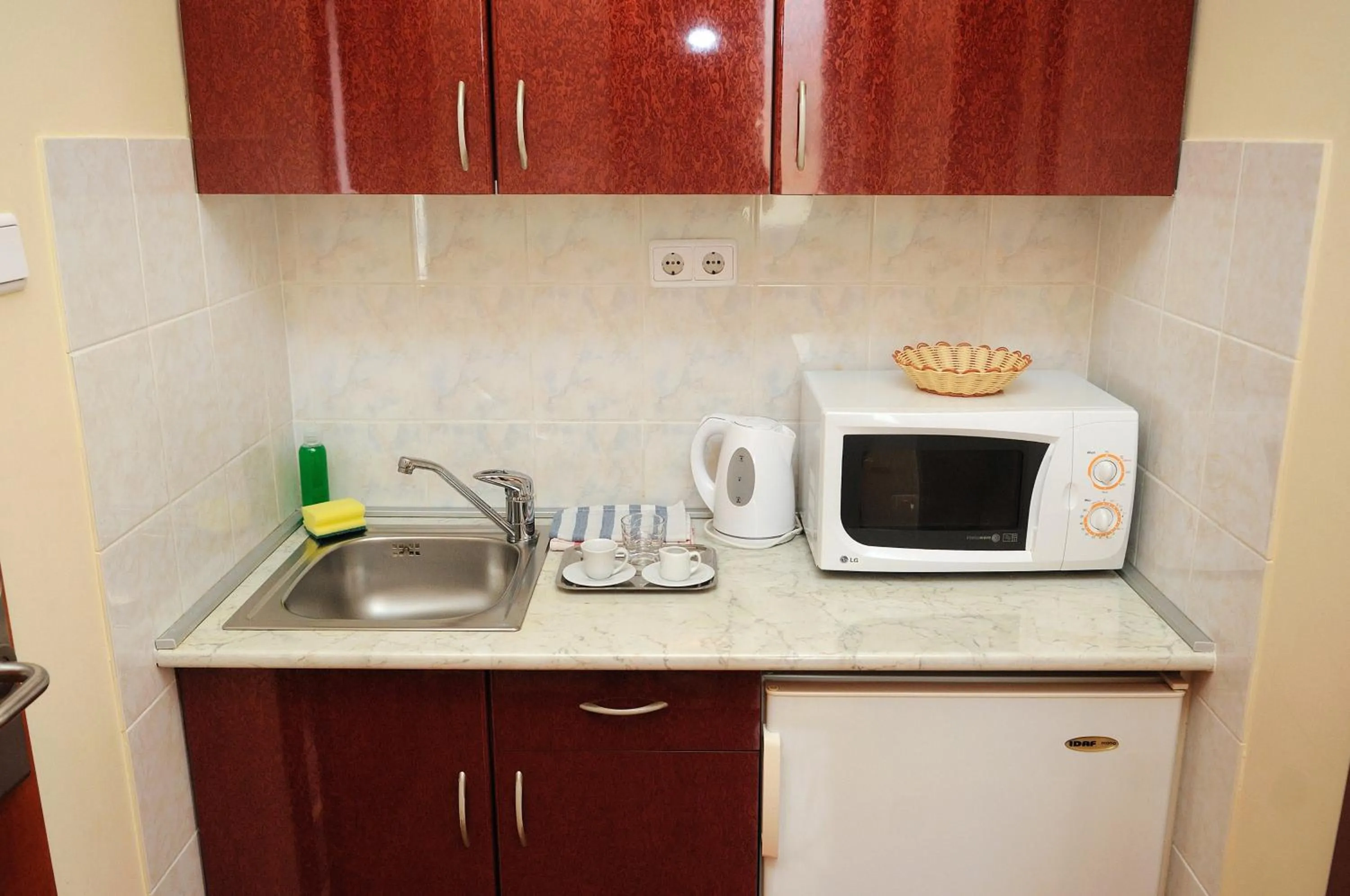 Kitchen or kitchenette in Apartman Bella Hotel
