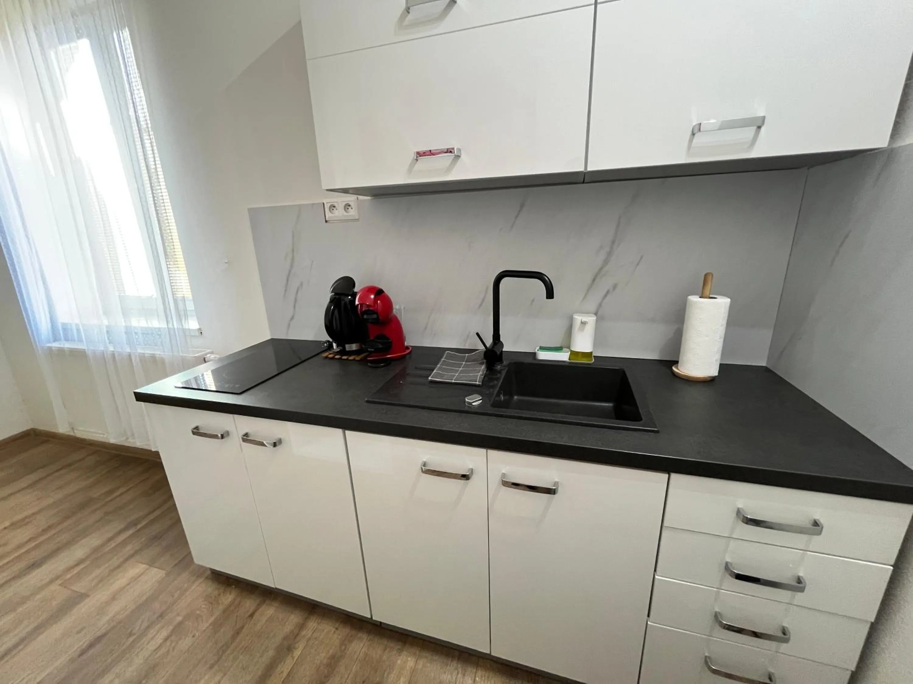 Kitchen or kitchenette in APARTMENTS TRENČÍN -Free Parking-