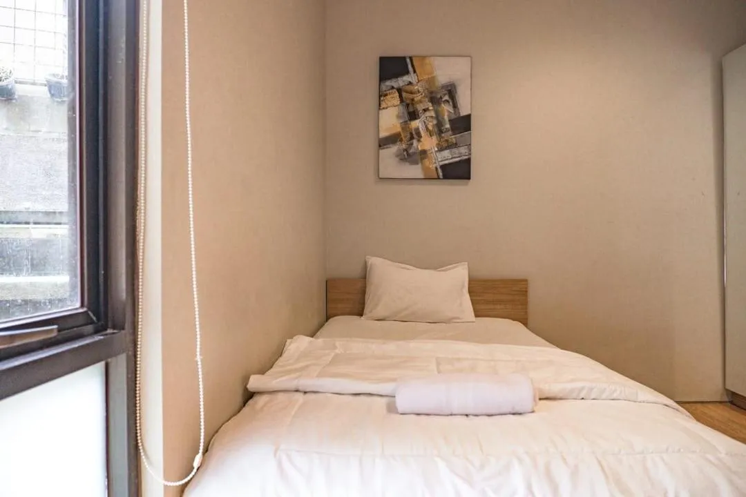 Bed in Three J Residence