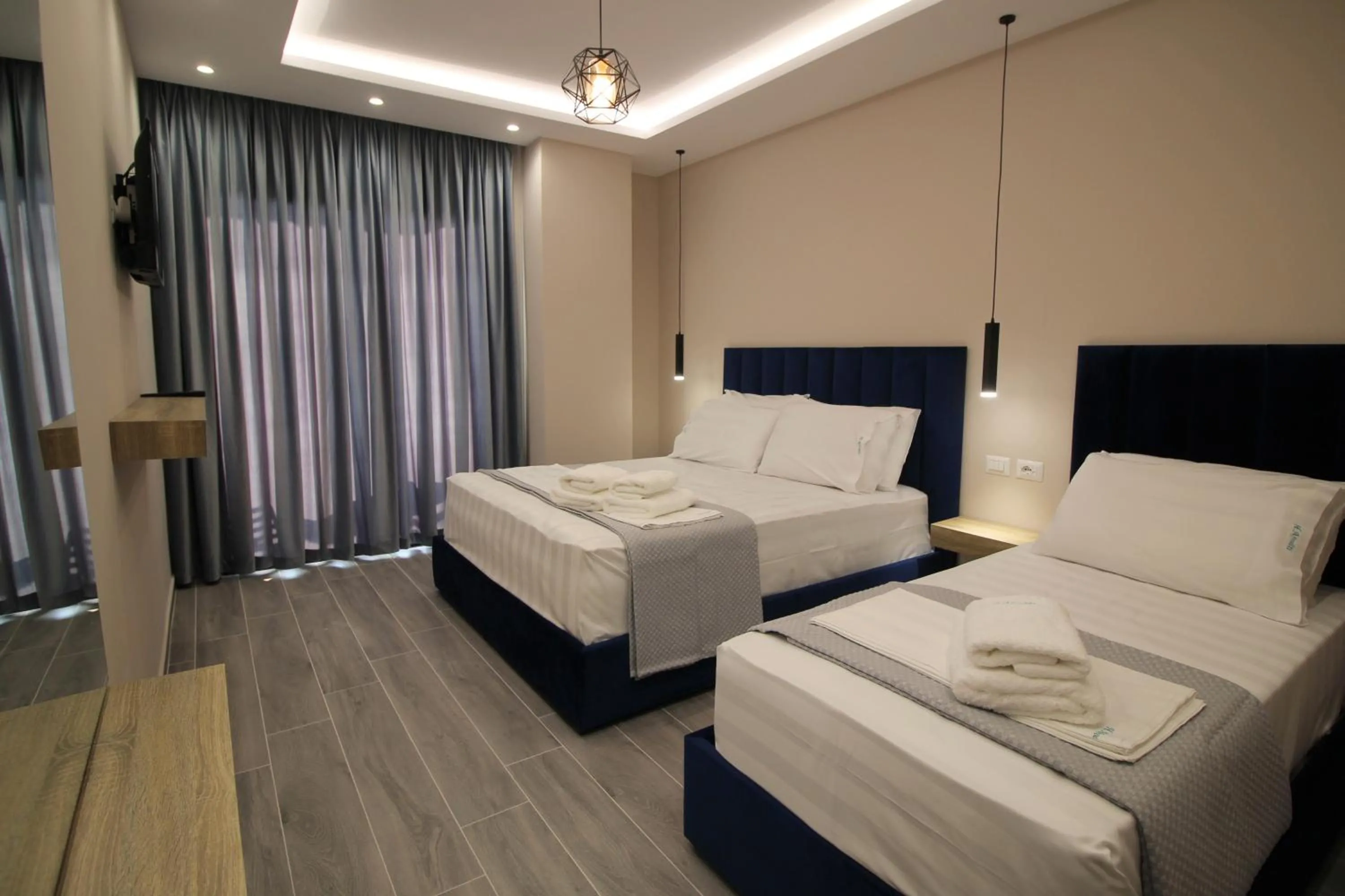 Deluxe Triple Room with Sea View in AFRODITE SUITES