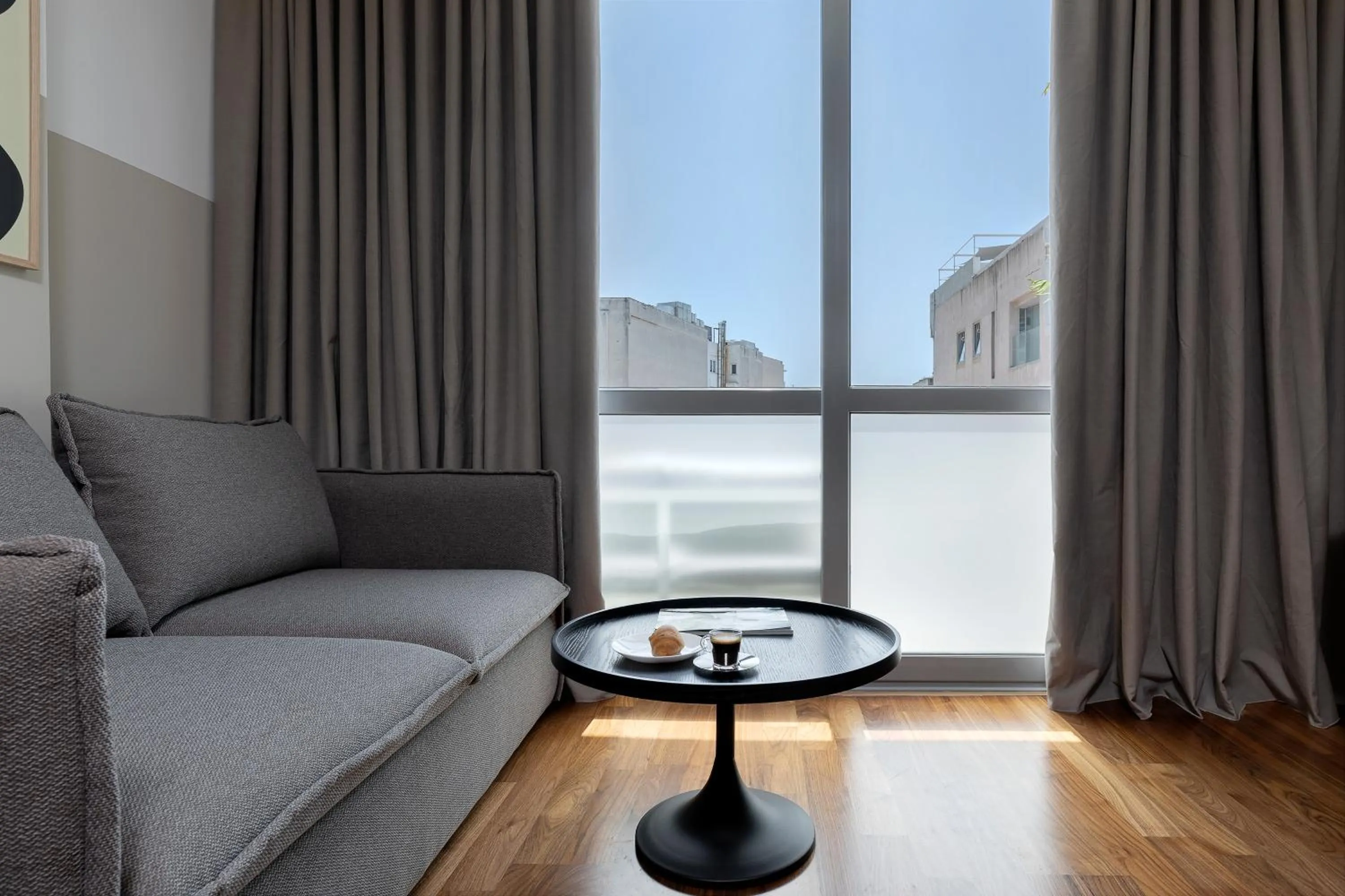 Living room in The Athenians Art Apartments