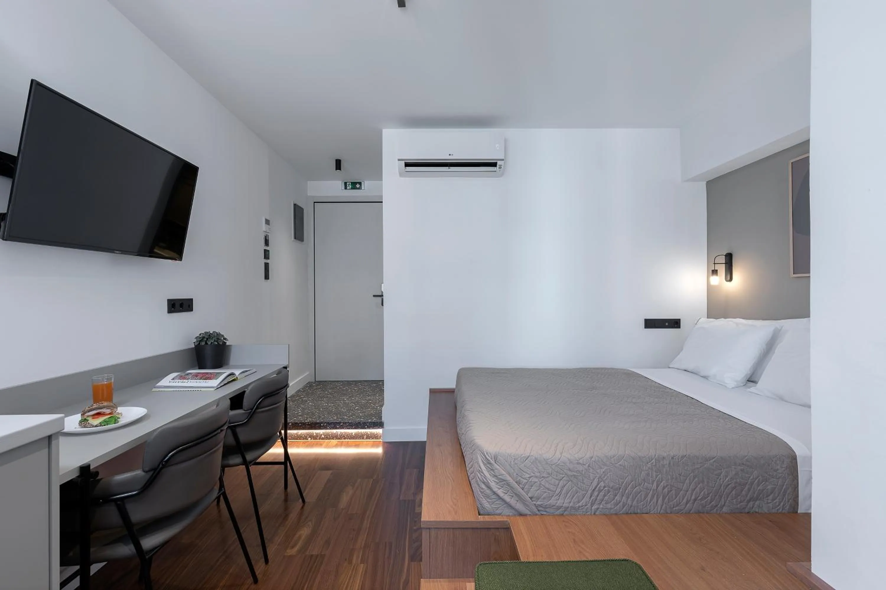 Bed in The Athenians Art Apartments