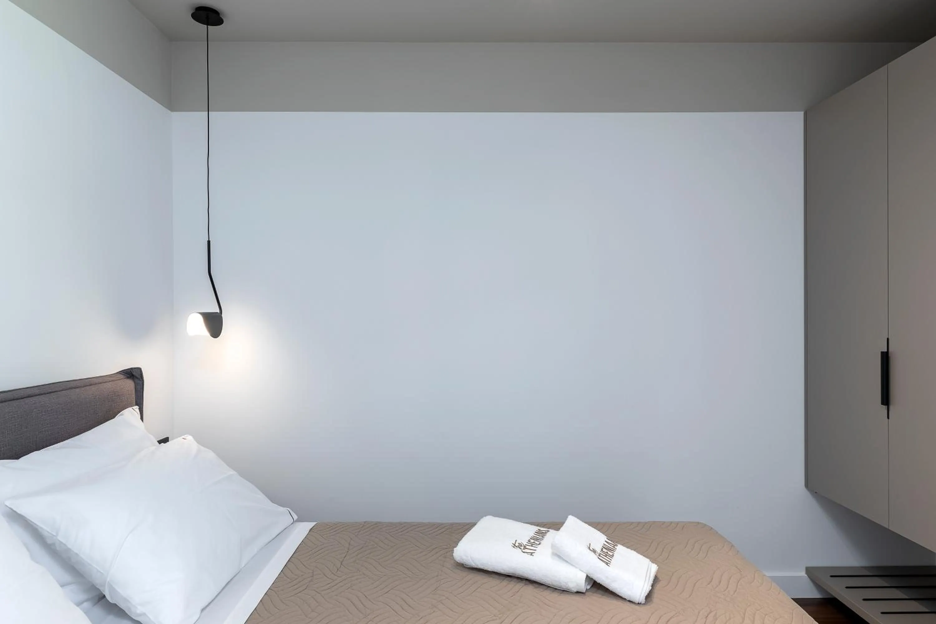 Bed in The Athenians Art Apartments