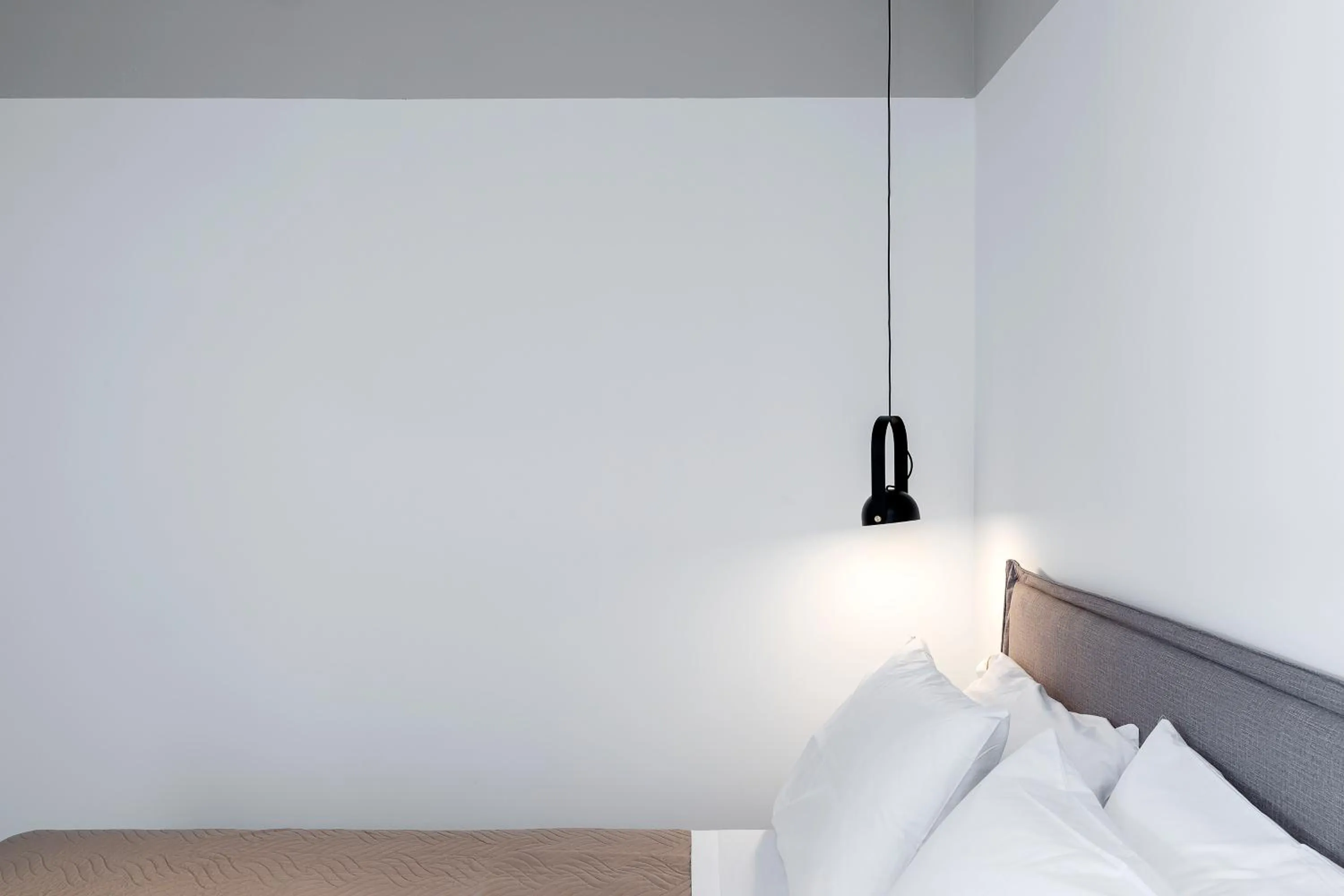 Bed in The Athenians Art Apartments