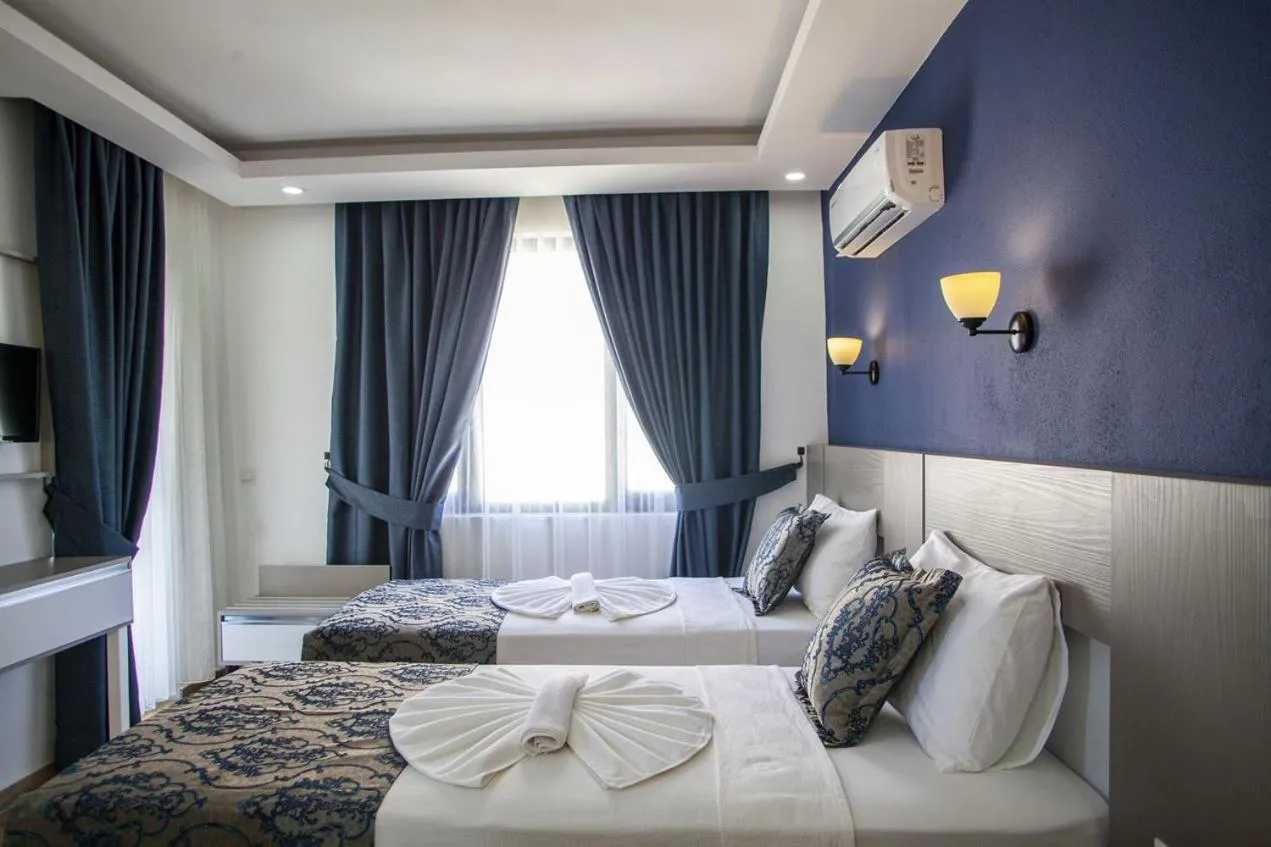 Bed in Demyra Boutique Hotel