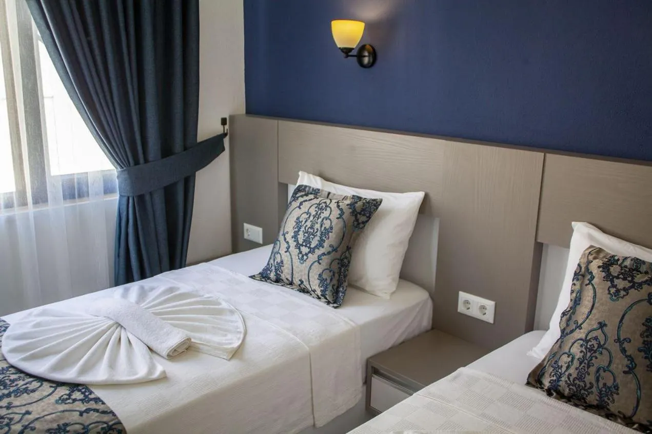 Bed in Demyra Boutique Hotel