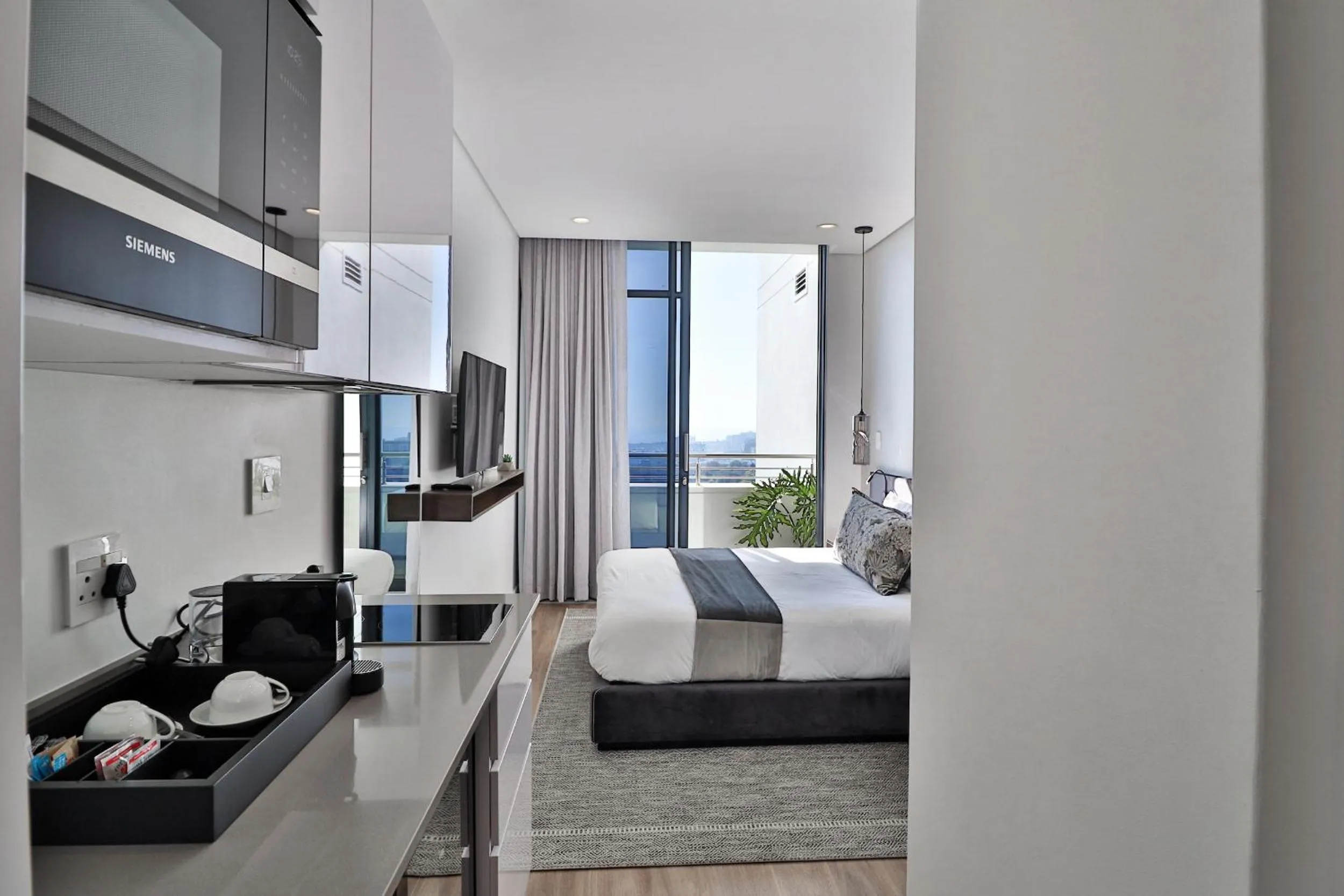 Balcony/Terrace, Bed in Reserved Suites Illovo